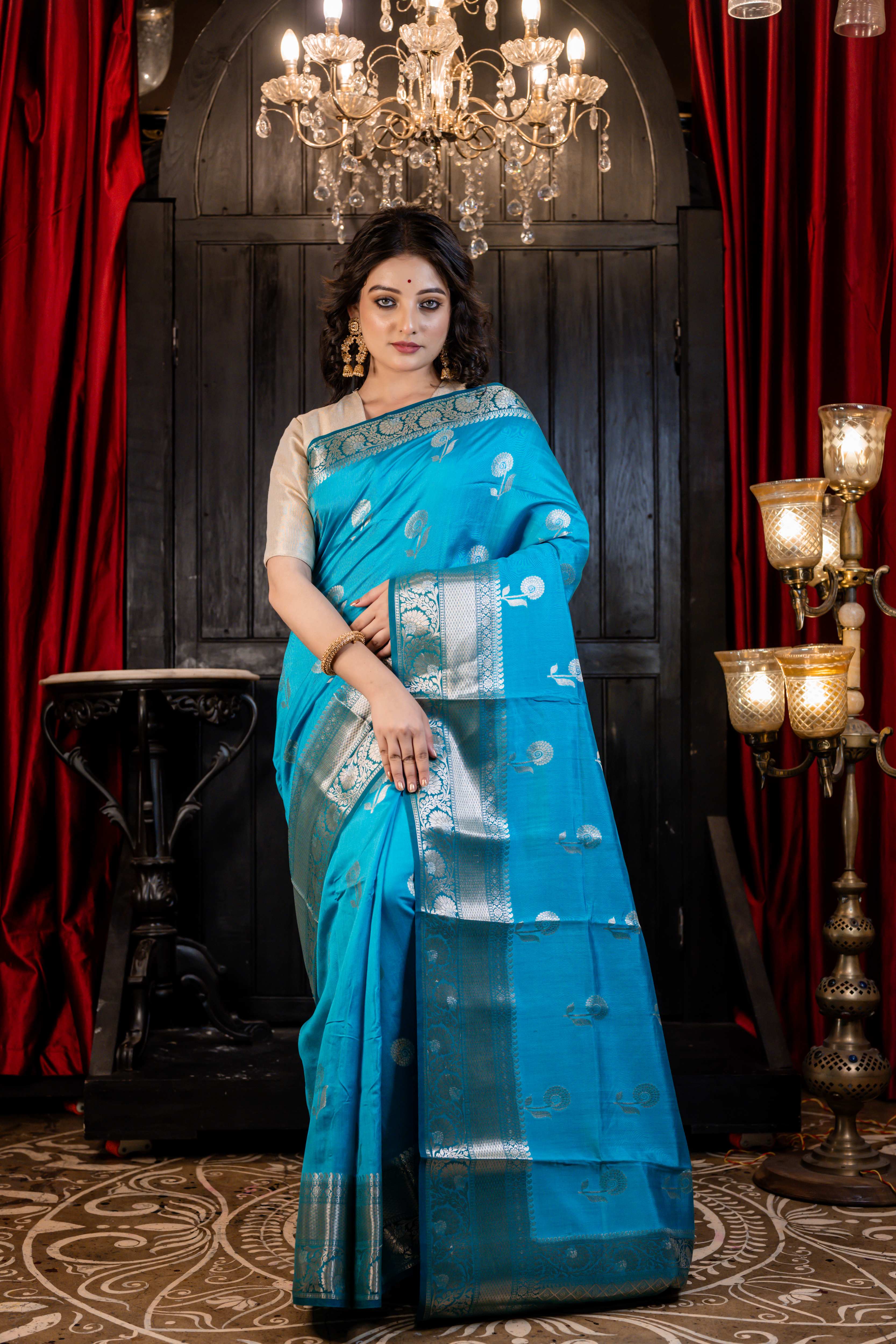 Arnavi || Turquoise Blue Pure Munga Handloom Banarasi Saree with all over 'Sona Rupa' Floral Buta and Border
