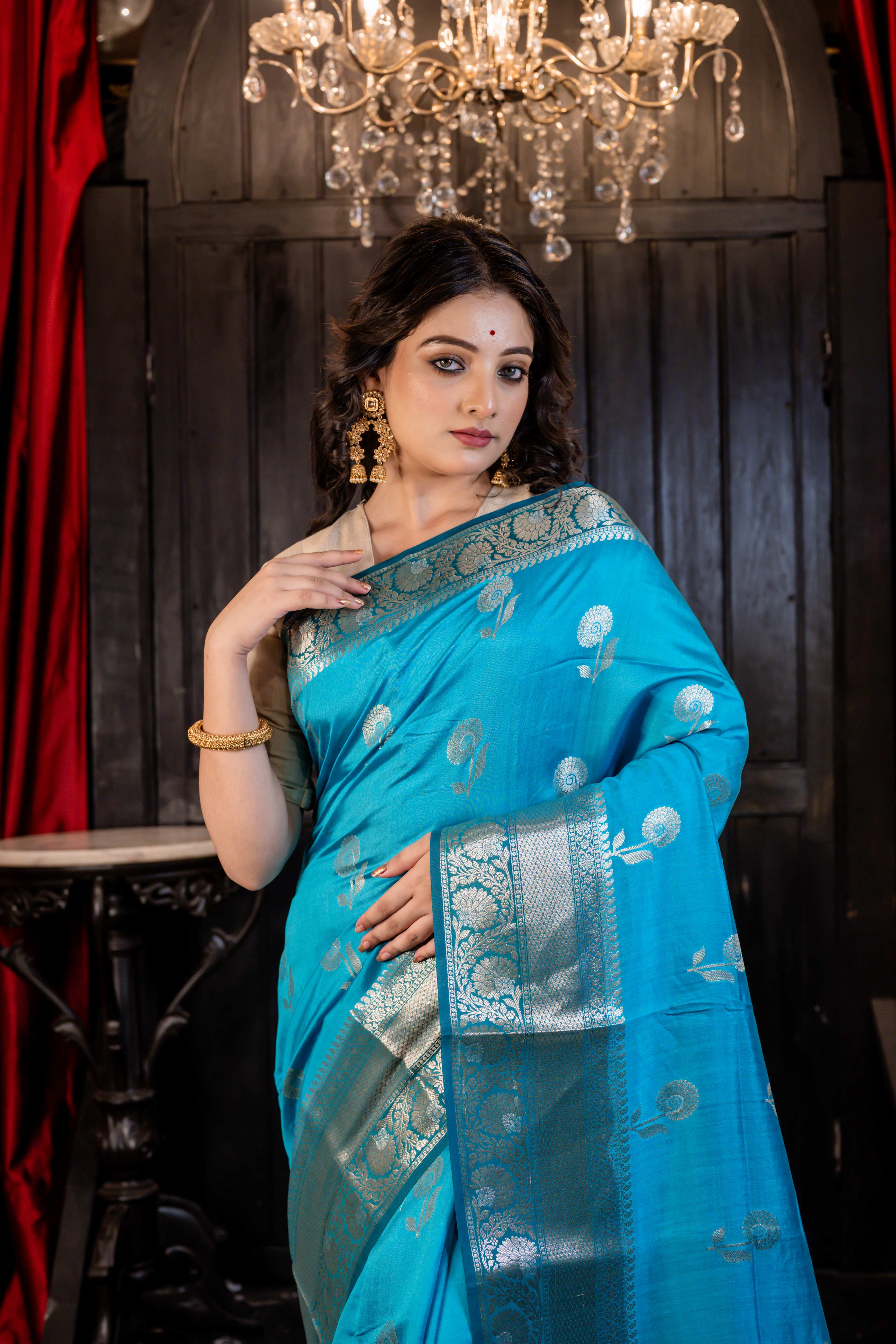 Arnavi || Turquoise Blue Pure Munga Handloom Banarasi Saree with all over 'Sona Rupa' Floral Buta and Border