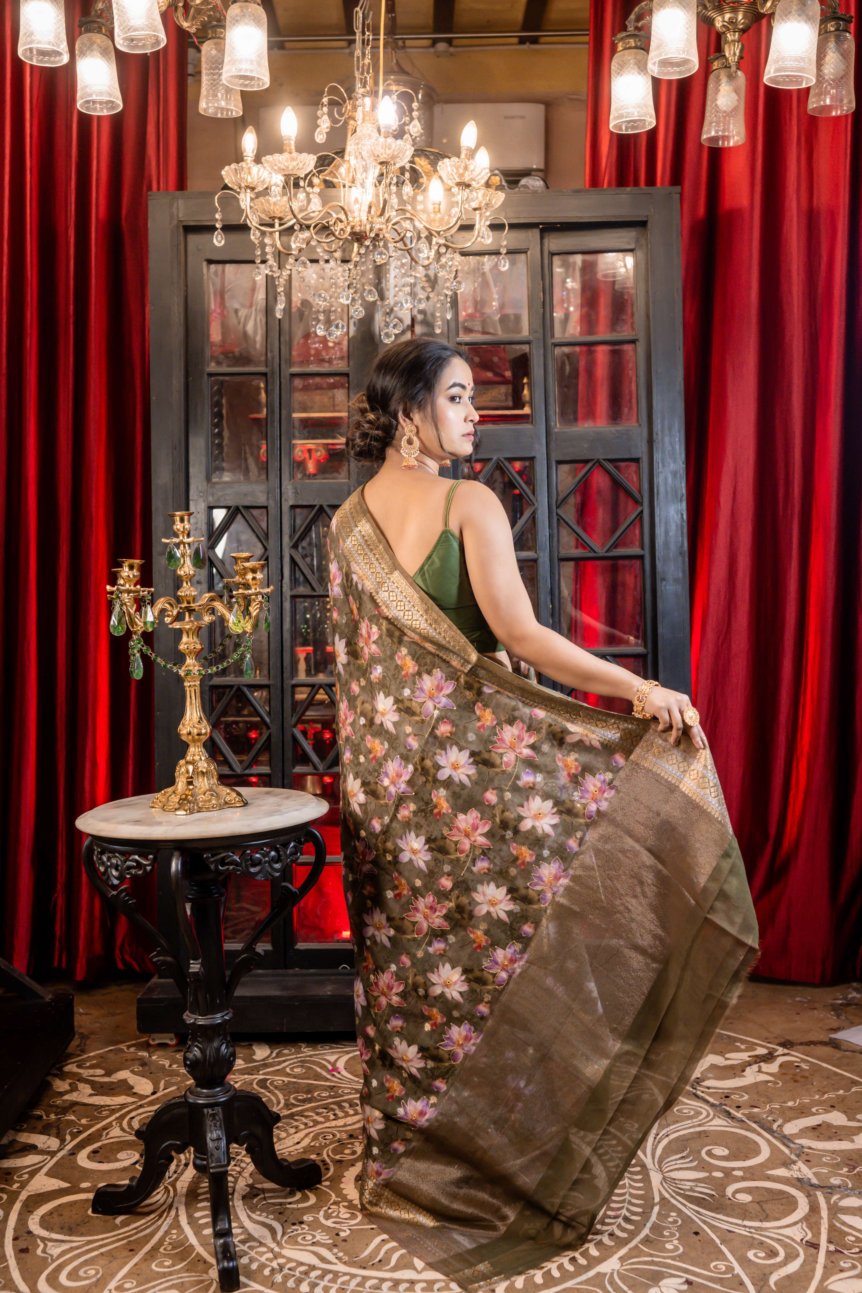 Kumud || Moss Green Chanderi blend Banarasi Saree with all over Floral Digital Print and Sona Rupa Buta with Mirror & Gold Zari highlights