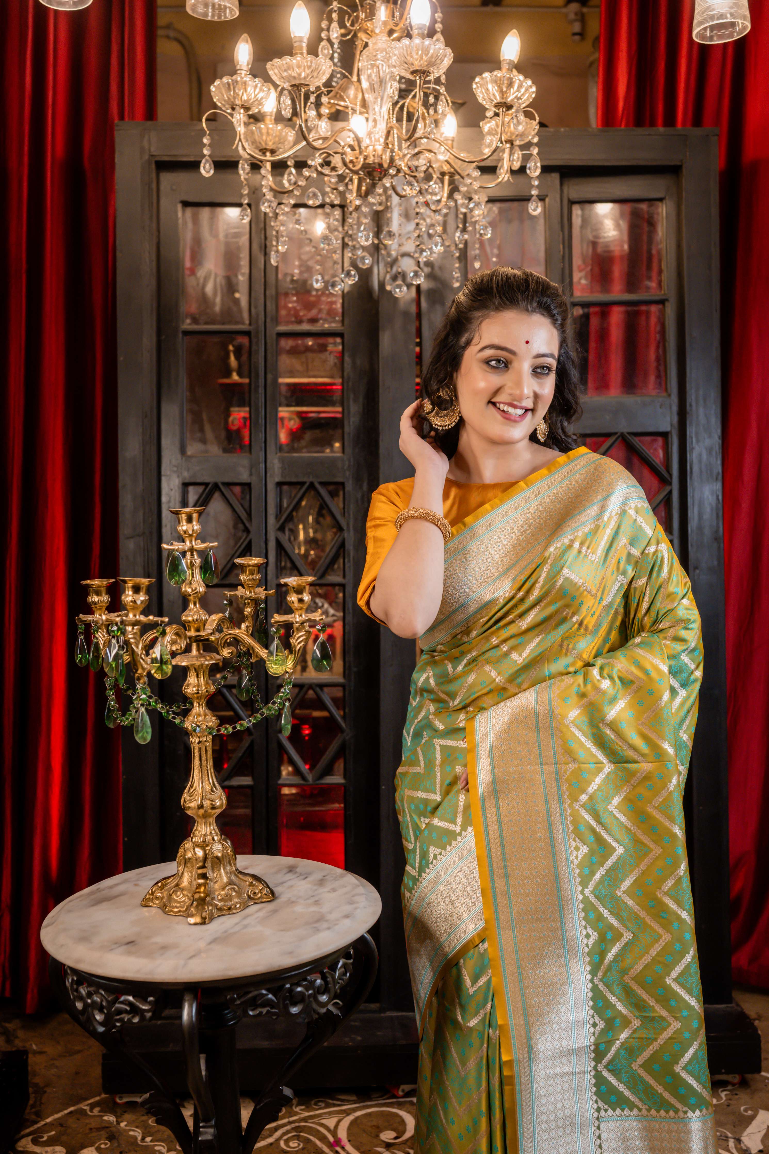 Dhruva || Metallic Teal Green & Mustard Yellow dual-tone Mashru Silk Banarasi Saree with all over Resham Buta and Silver Zari Zigzag Stripes