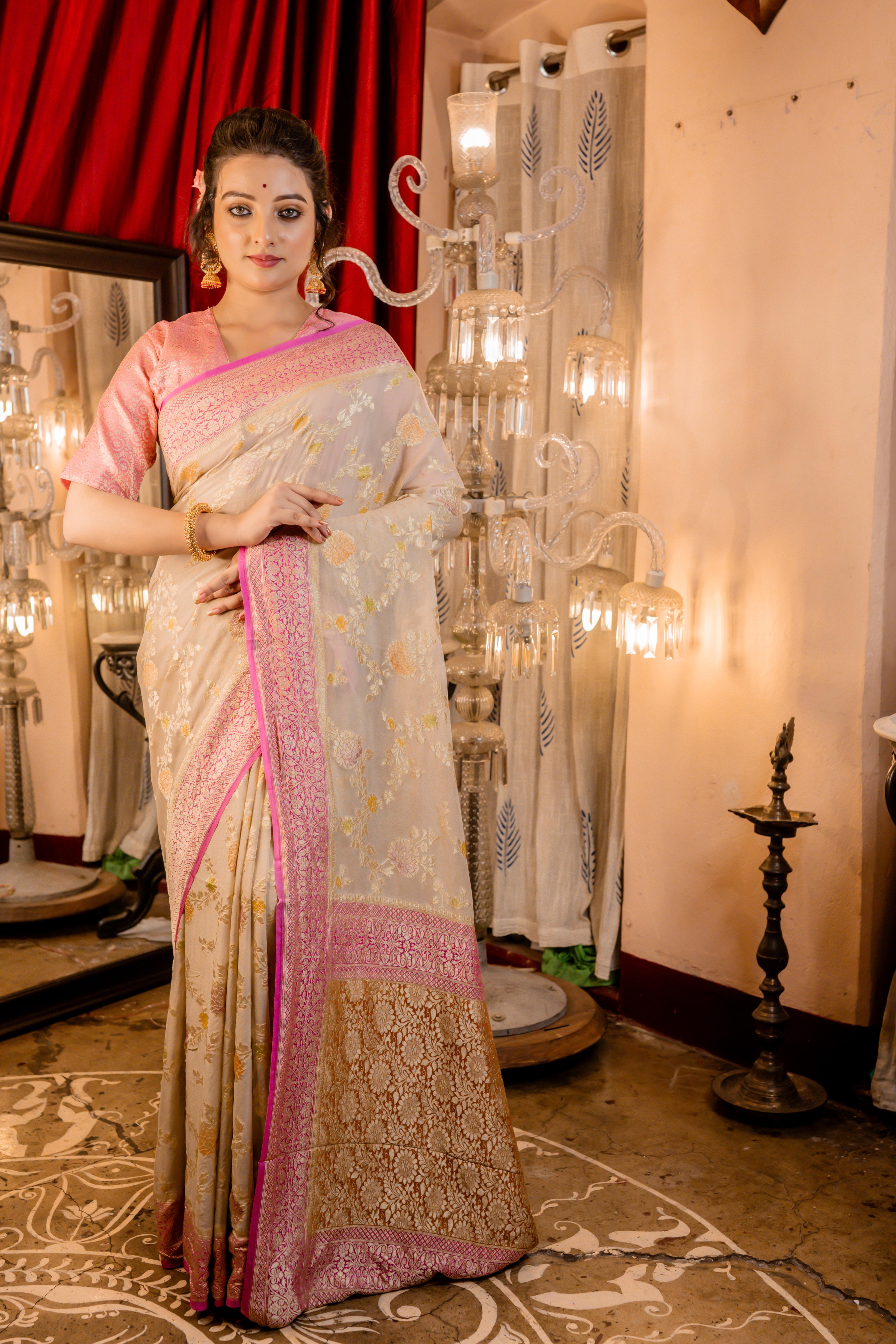 Barkha || Oyster Grey Khaddi Georgette Banarasi Saree with all over Rifling Handbrush Multi-colour & Matte Gold Zari Floral motif Jangla and Lilac Pink border
