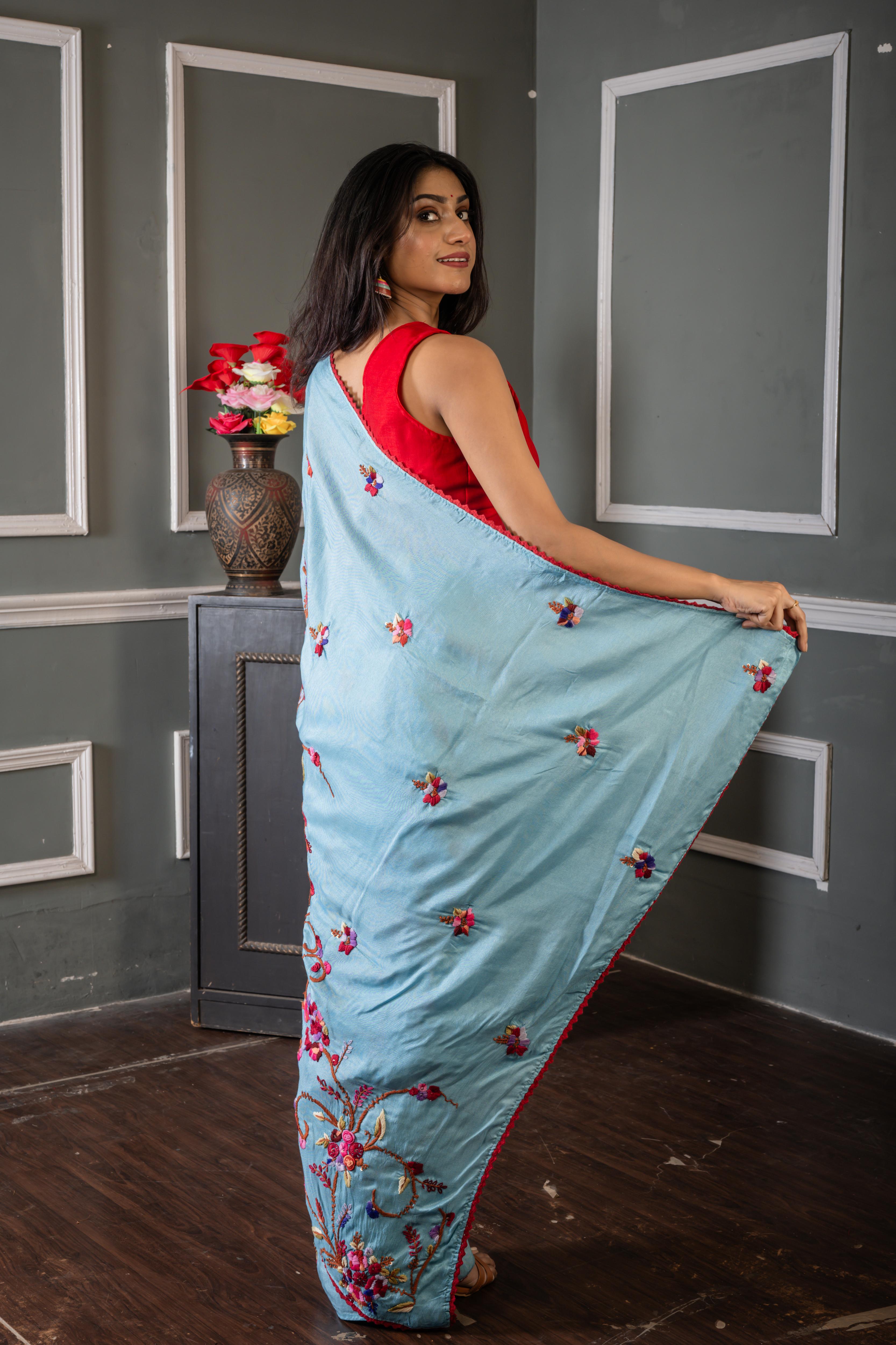 Roya || Sky Blue Russian Silk Hand Embroidery Saree with all over Multi-colour Resham Boolean Parsi Floral motif and Sequins Highlights