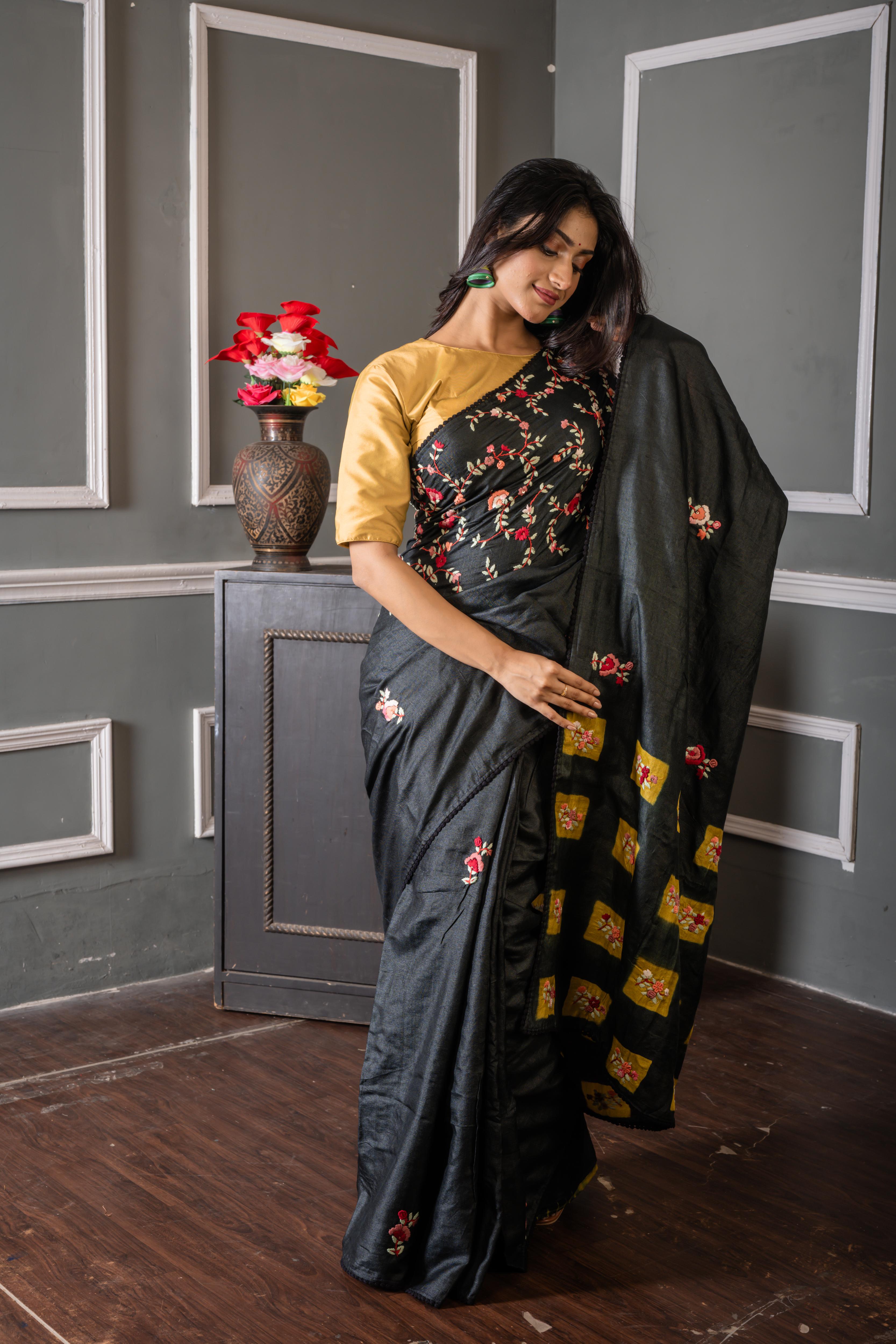 Nayanika || Carbon Black Pure Tussar Silk Hand Embroidery Saree with all over Multi-colour Resham Boolean Floral motif, Sequins Highlights and Olive Green Shibori Print Pallu