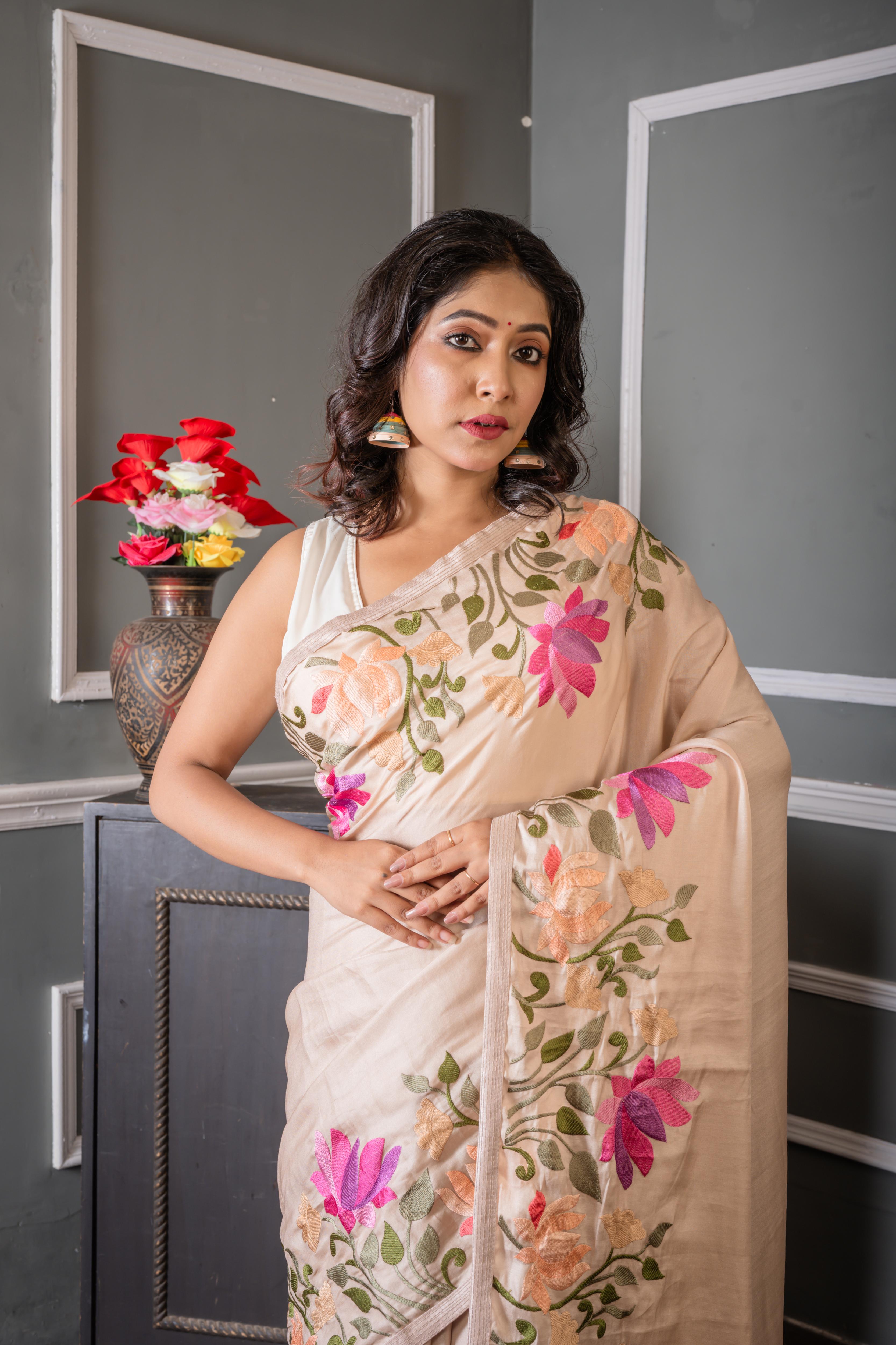 Shrinika || Smokey Taupe Soft Tussar Silk Hand Embroidery Saree with Plain Body and Multi-colour Lotus motif on border