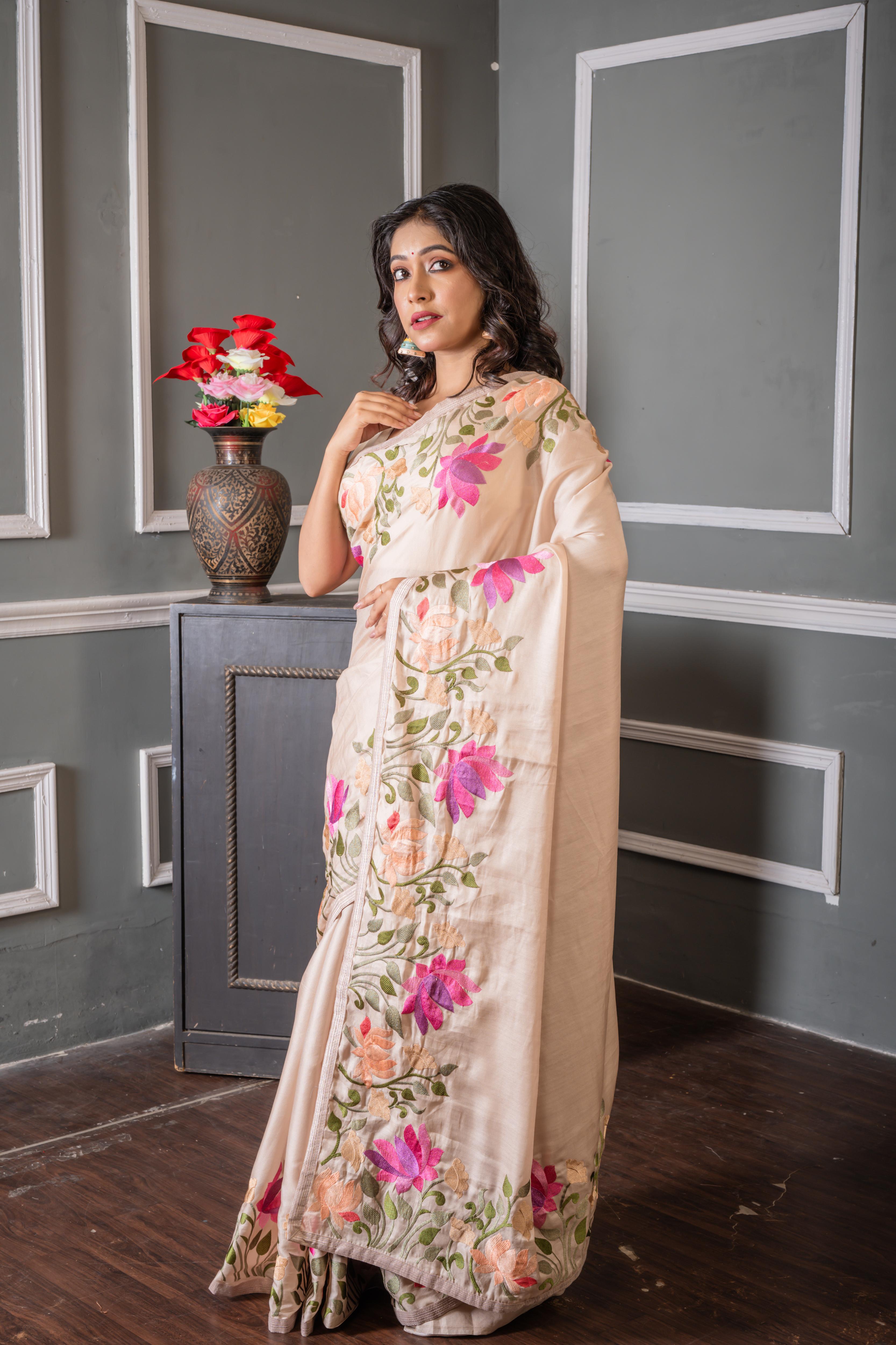Shrinika || Smokey Taupe Soft Tussar Silk Hand Embroidery Saree with Plain Body and Multi-colour Lotus motif on border