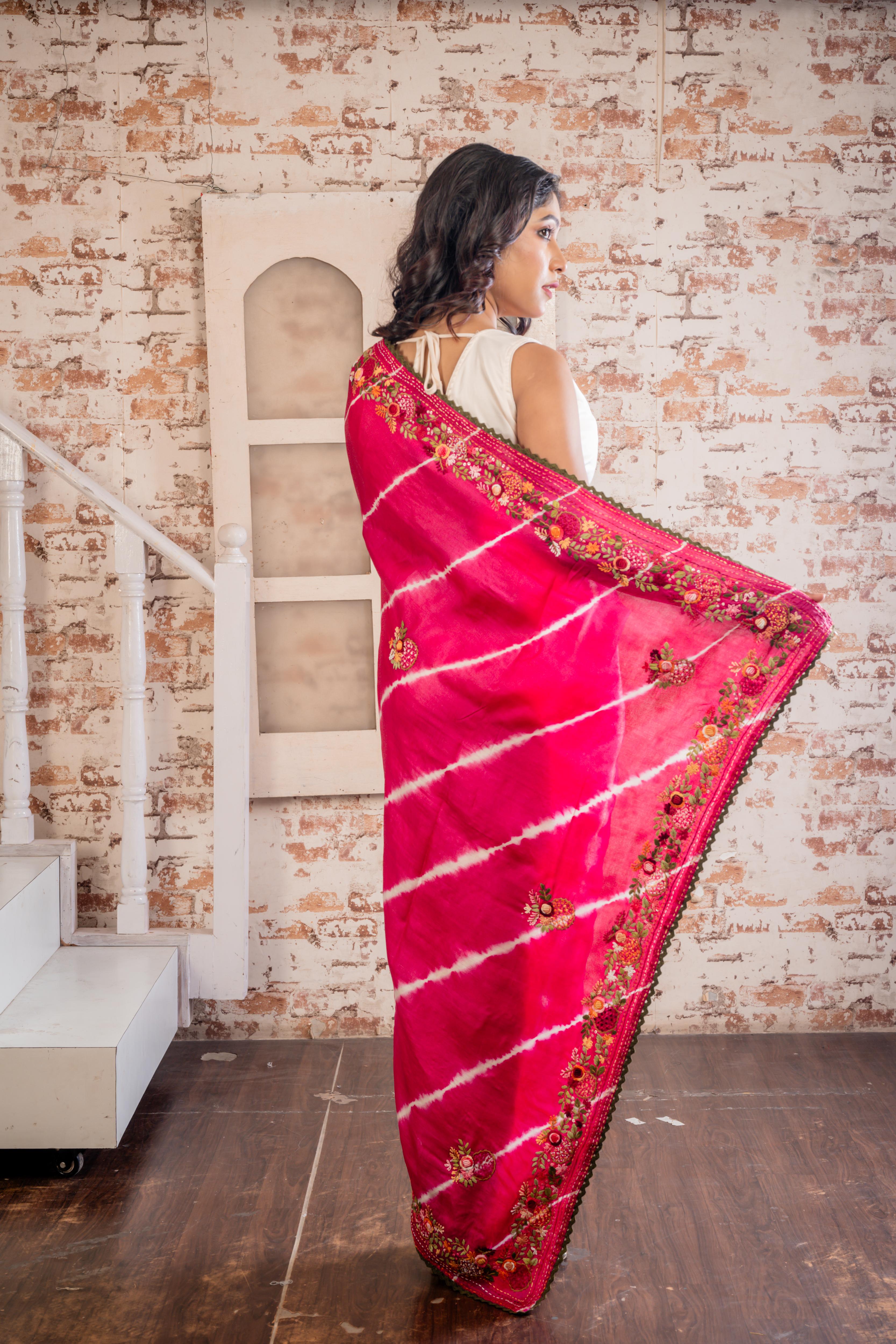 Saloni || Magenta Pure Tussar Silk Hand Embroidery Saree with all over White Shibori Stripes and Multi-colour Resham French Knot Parsi Floral motif and Sequins Highlights