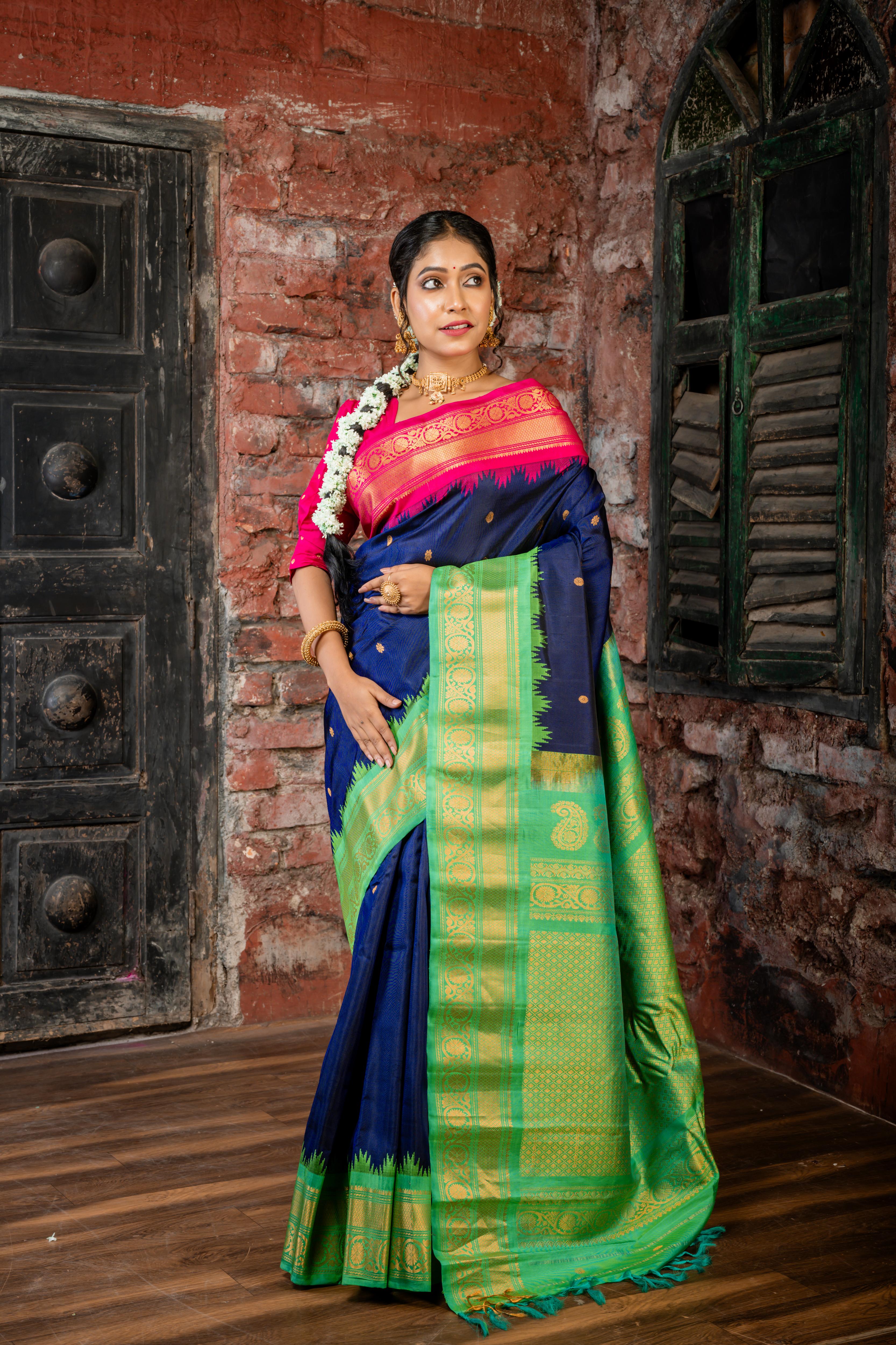 Meenakshi || Violet Pure Gadwal Silk Handloom Saree with all over Antique Gold Buti, Magenta & Parrot Green 'Temple' & Antique Gold Zari 'Ganga-Jamuna' Border and Parrot Green Pallu in Traditional Golden Zari design