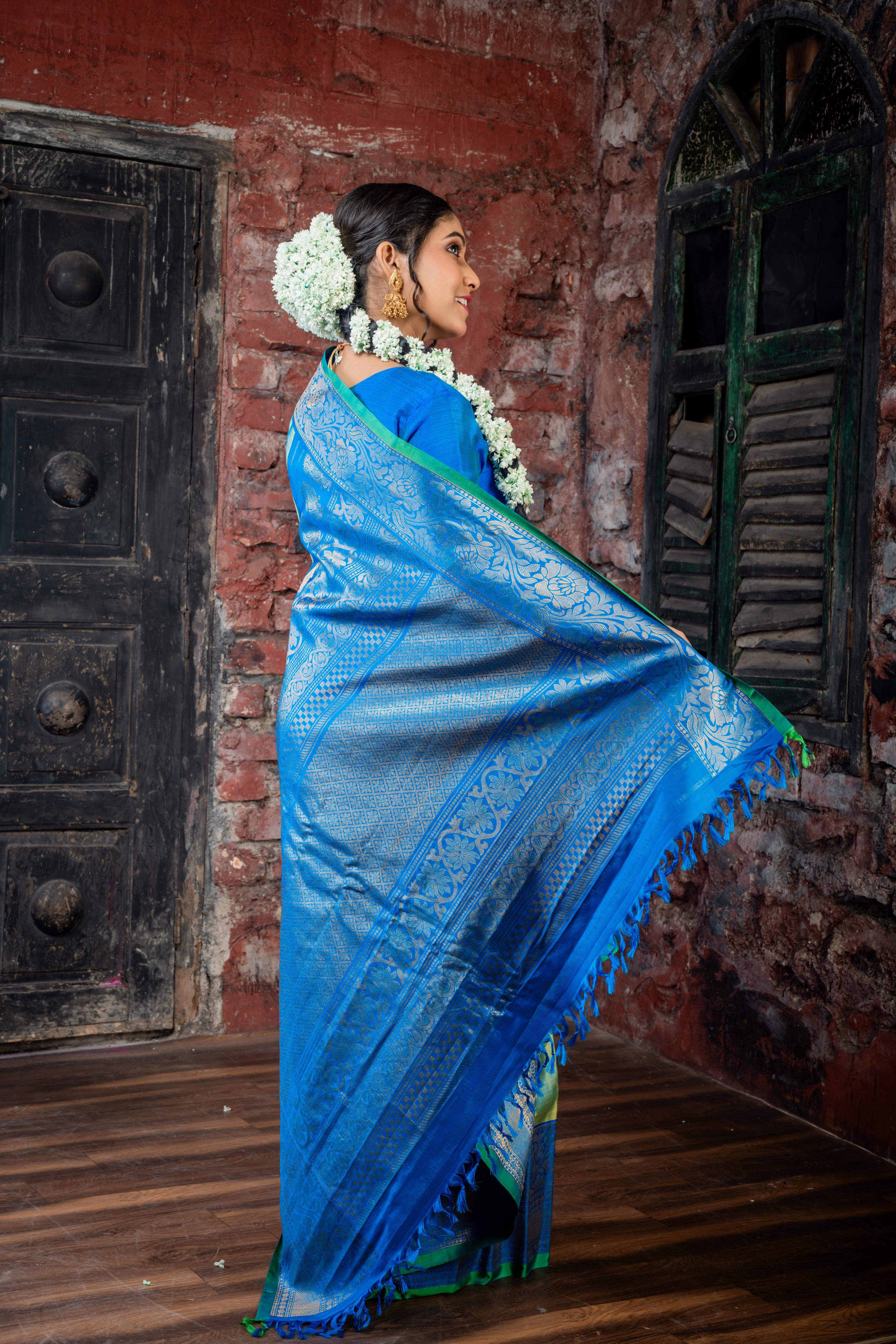 Narayani || Olive Green & Peacock Blue dual tone Pure Gadwal Silk Handloom Saree with all over Antique Gold Zari 'Kalka' Buta; Peacock Blue, Green & Antique Gold Zari Traditional design Border and Brocade Pallu