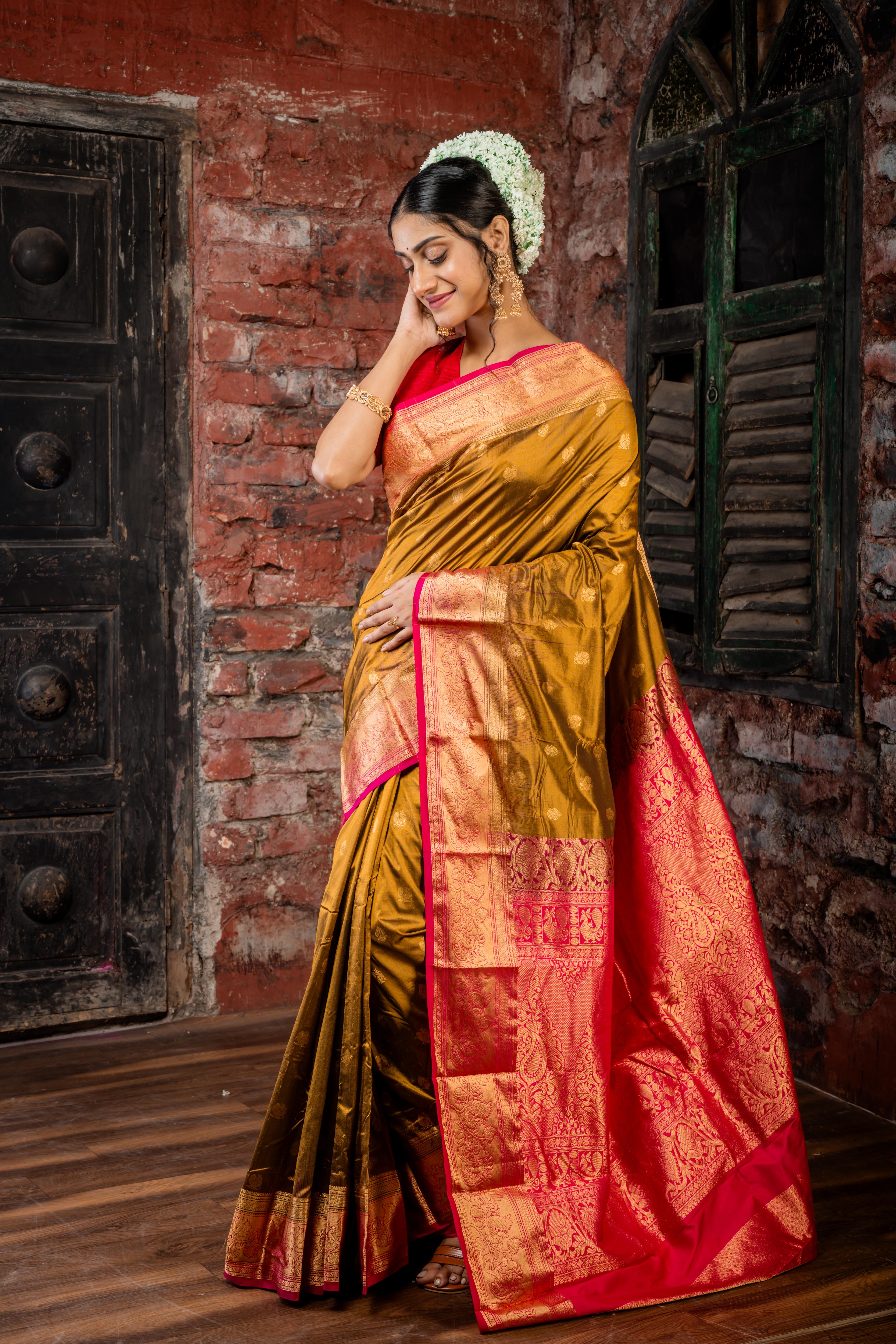 Mrunalini || Olive Brown & Gold dual tone Pure Kanjivaram Silk Handloom Saree with all over Golden Zari 'Peacock' motif Buta, Magenta broad & Golden Zari Border and traditional design Pallu
