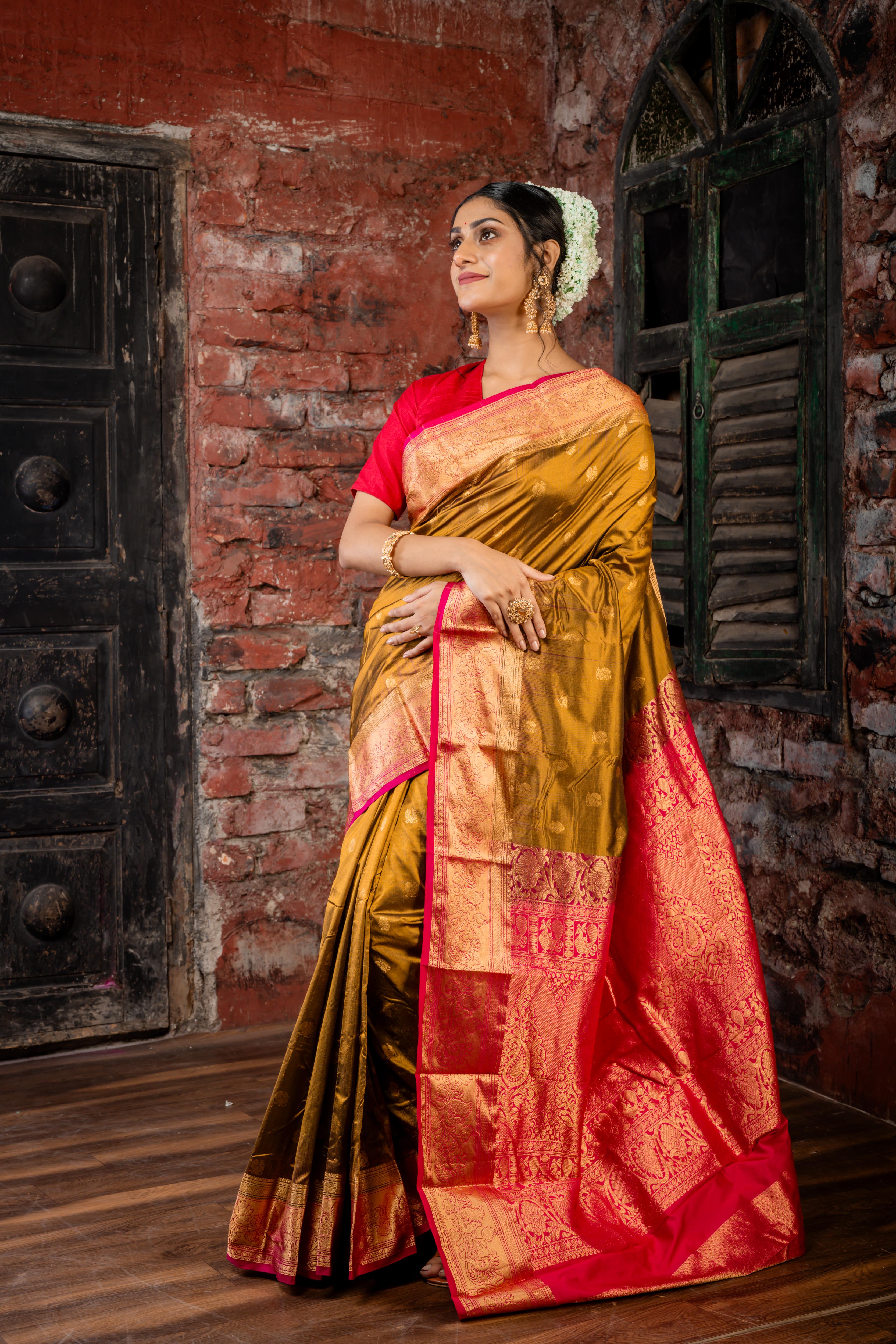 Mrunalini || Olive Brown & Gold dual tone Pure Kanjivaram Silk Handloom Saree with all over Golden Zari 'Peacock' motif Buta, Magenta broad & Golden Zari Border and traditional design Pallu