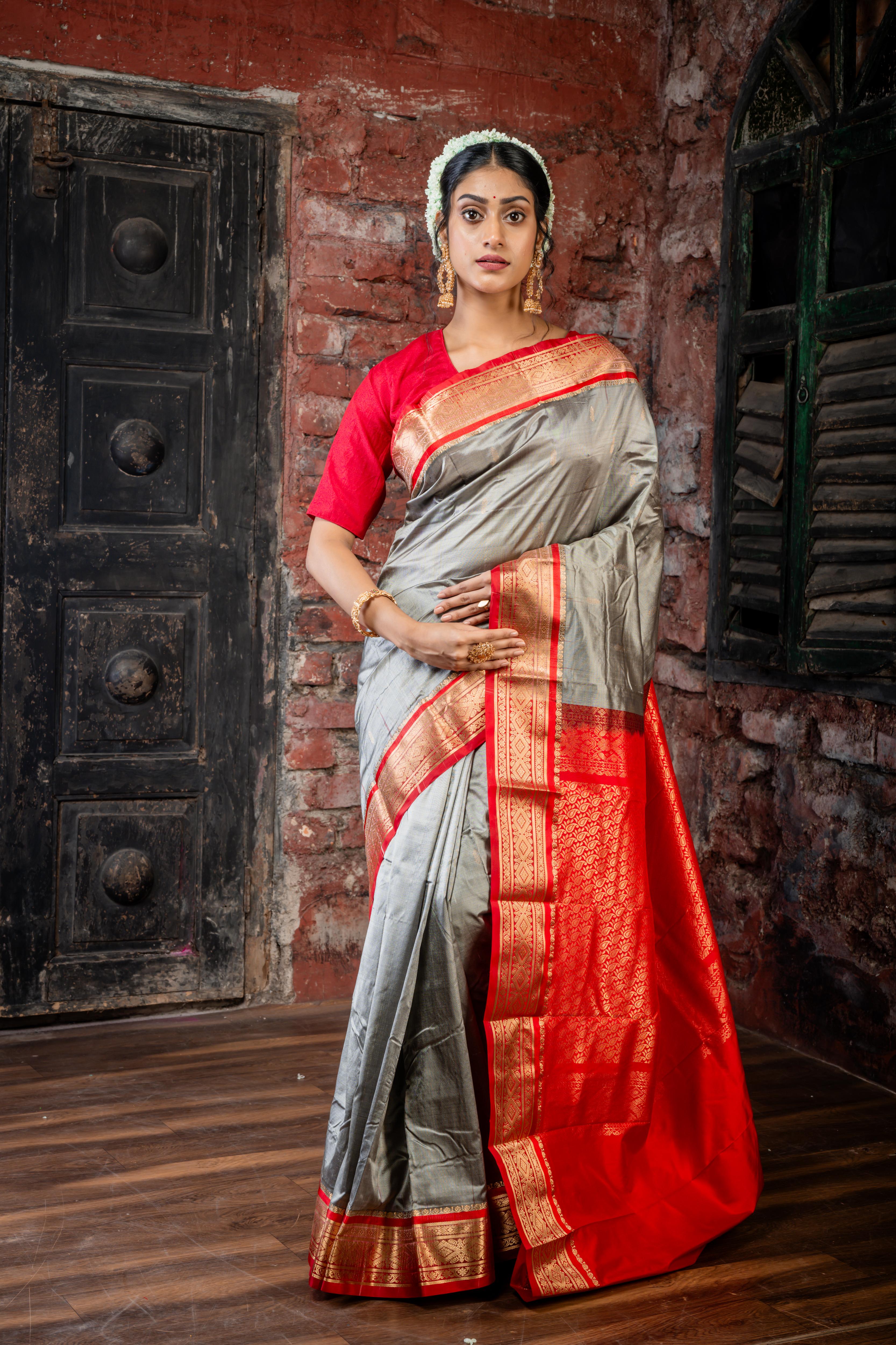 Amala || Smokey Grey Kanjivaram Silk Saree with all over Matte Gold Zari Buti, Red & Matte Gold Zari Border and Red Pallu in Matte Gold Zari Traditional 'Kalka' design