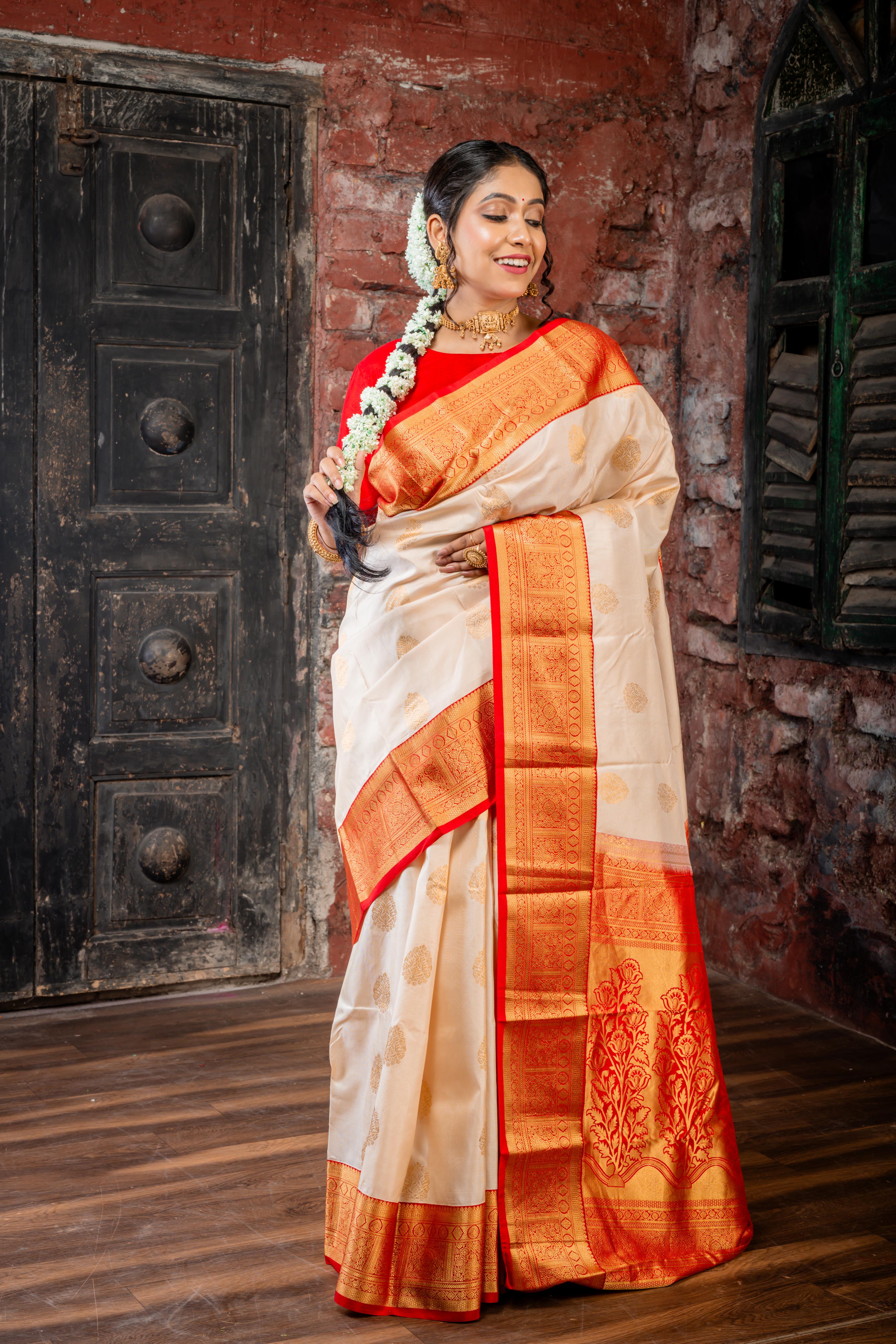 Chinmayi || Ivory Gold Pure Kanjivaram Silk Handloom Saree with all over Golden Zari traditional Buta, Red broad & Golden Zari Border and traditional Floral motif Pallu