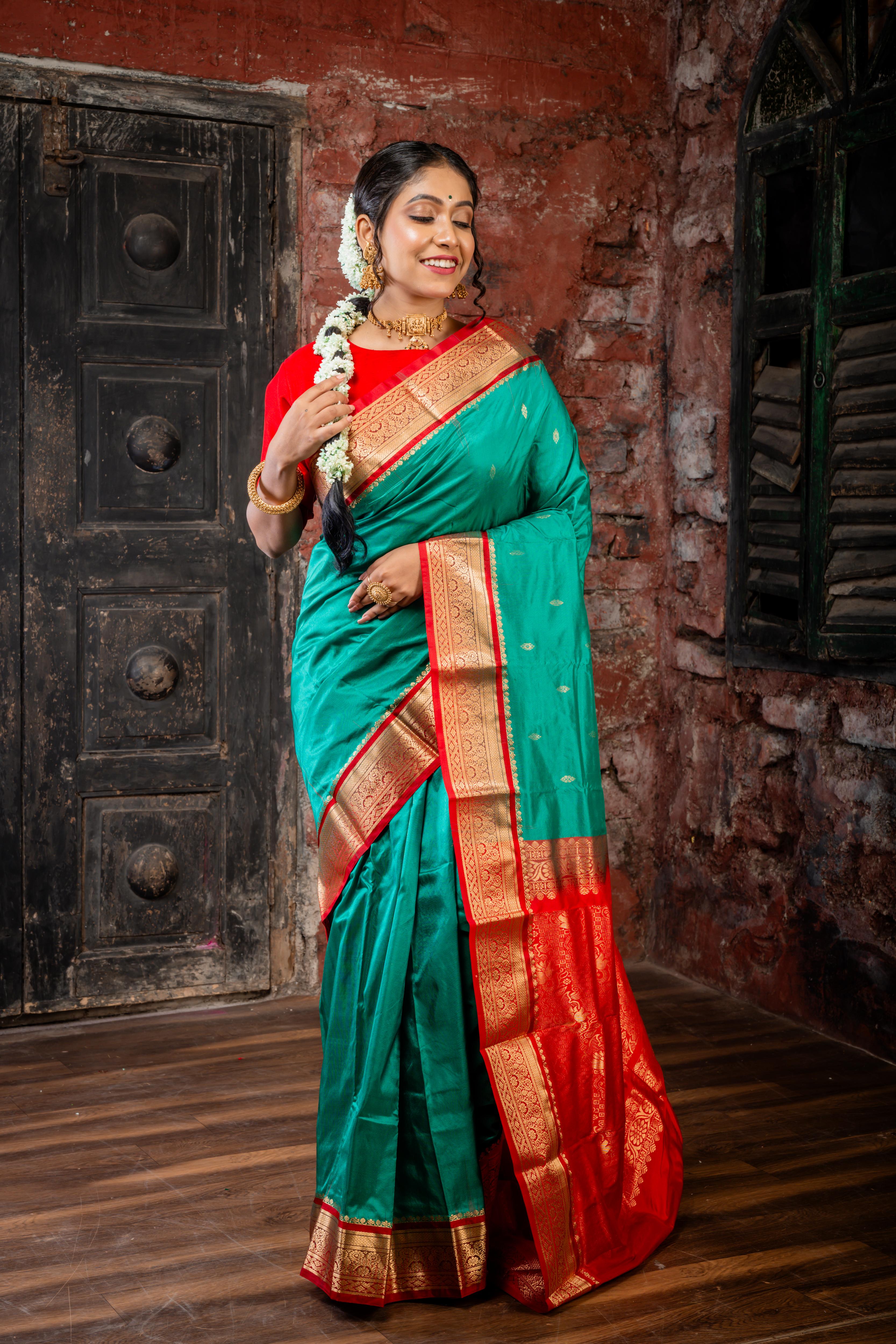 Vamika || Emerald Green Kanjivaram Silk Saree with all over Matte Gold Zari Buta and Dark Red & Matte Gold Zari Traditional design Border & Pallu