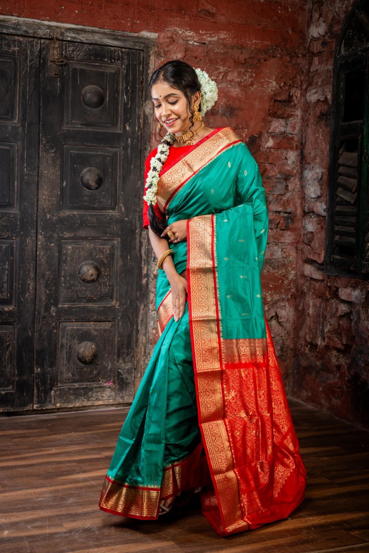 Vamika || Emerald Green Kanjivaram Silk Saree with all over Matte Gold Zari Buta and Dark Red & Matte Gold Zari Traditional design Border & Pallu