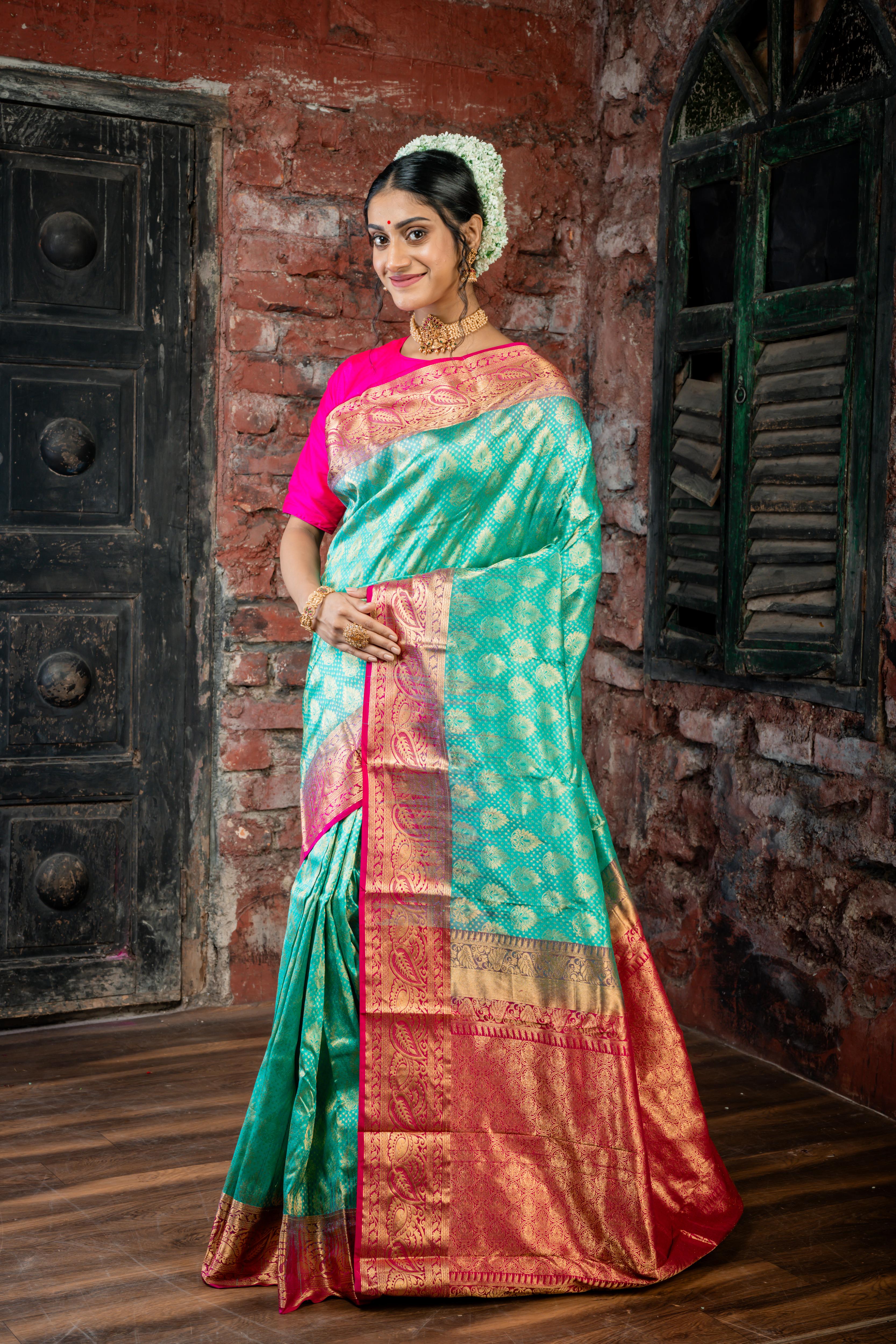 Keerthi || Teal Green Pure Kanjivaram Silk Handloom Saree with all over Matte Gold Zari traditional motif Buta, Magenta broad & Golden Zari Border and traditional design Brocade Pallu