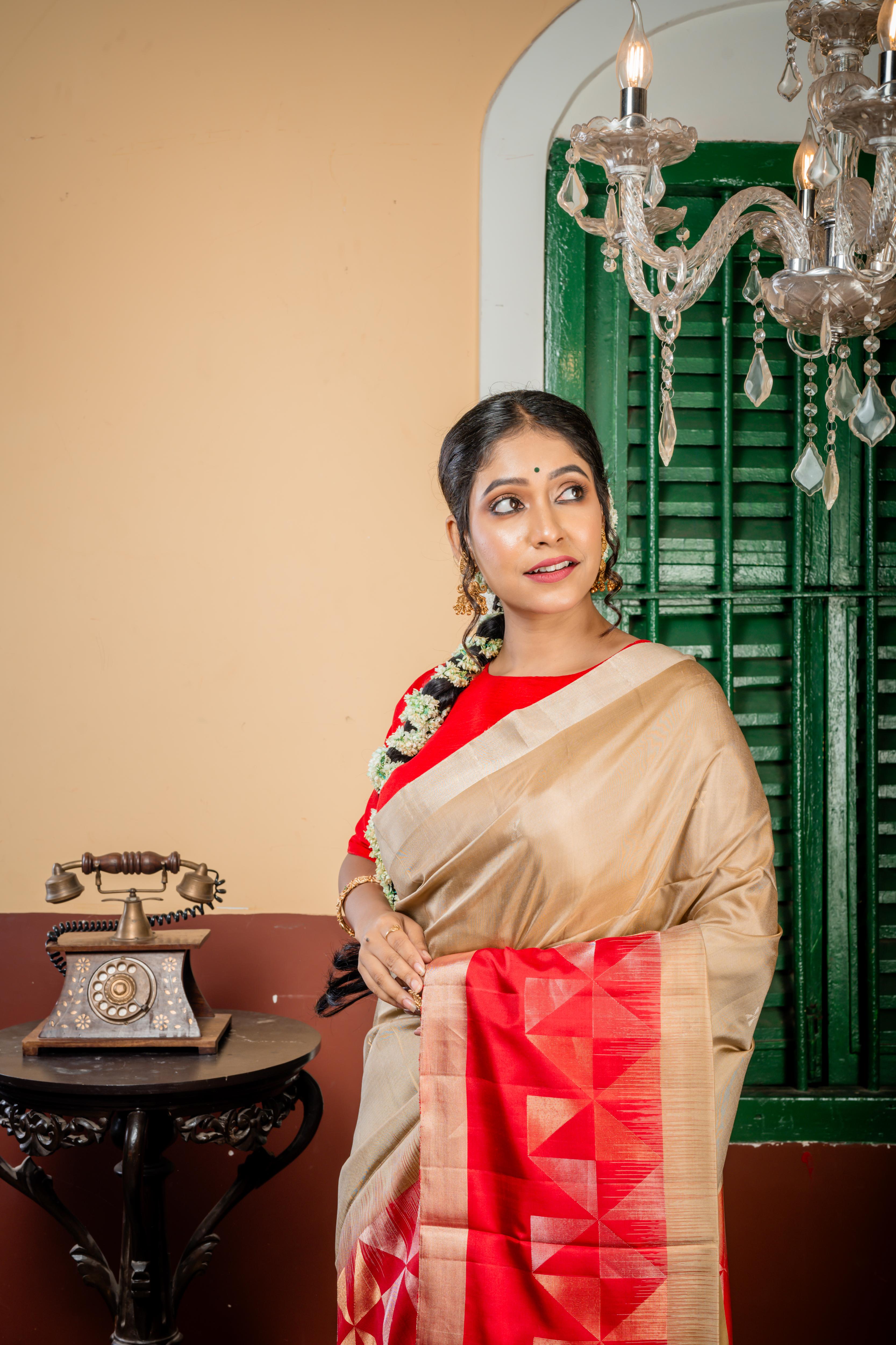 Ranjitha || Beige Gold Pattu Soft Silk Handloom Saree with all over Matte Gold & Matte Silver Zari Abstract Buta, Plain Copper Border and Red Border & Pallu in Antique Gold & Antique Silver Zari Abstract Triangle design