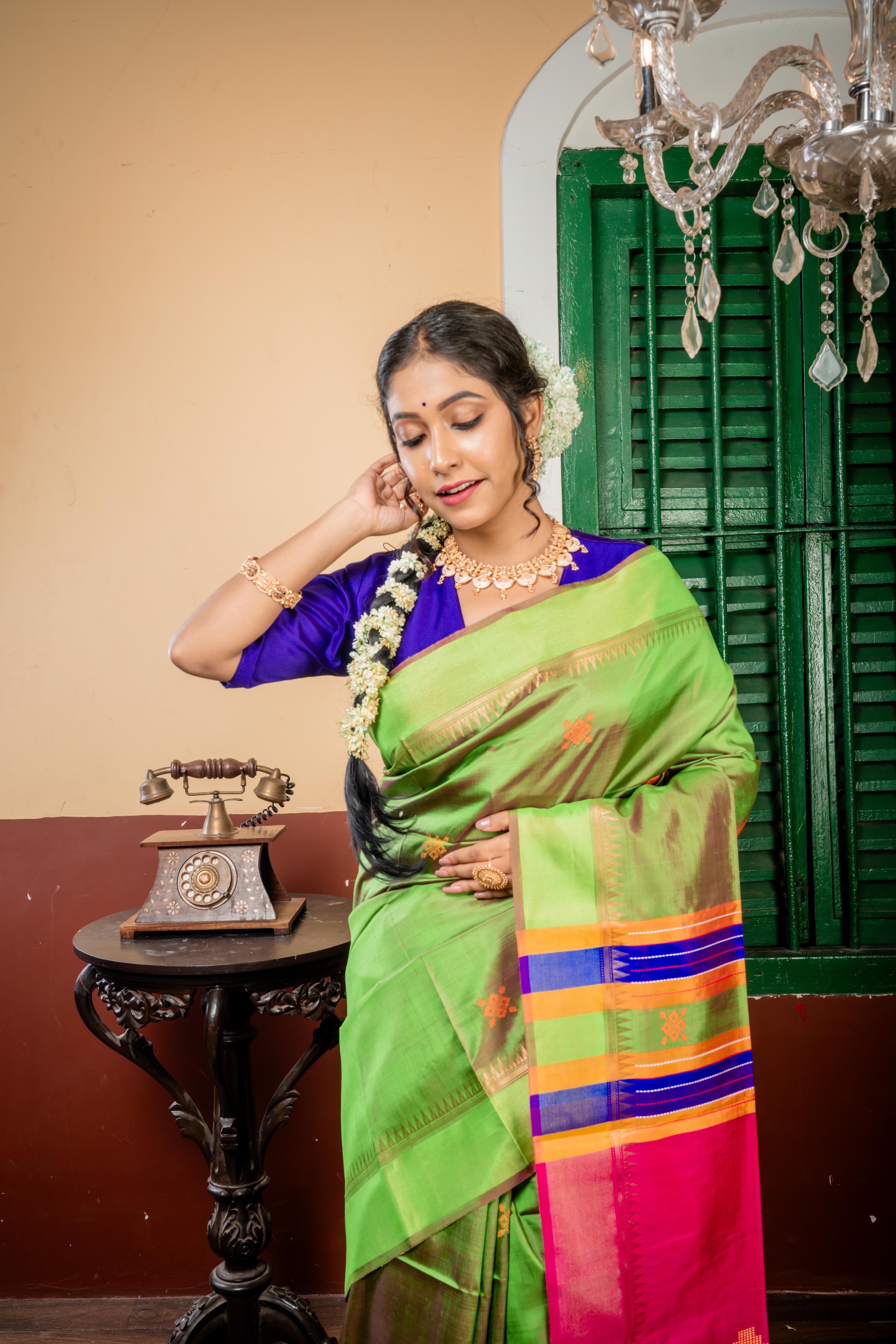 Ashwini || Parrot Green & Magenta dual tone Pure Bishnupuri Katan Handloom 'Kalakshetra' Embroidery Saree with all over Multi-colour Buta and Stripe & 'Horse' motif Pallu