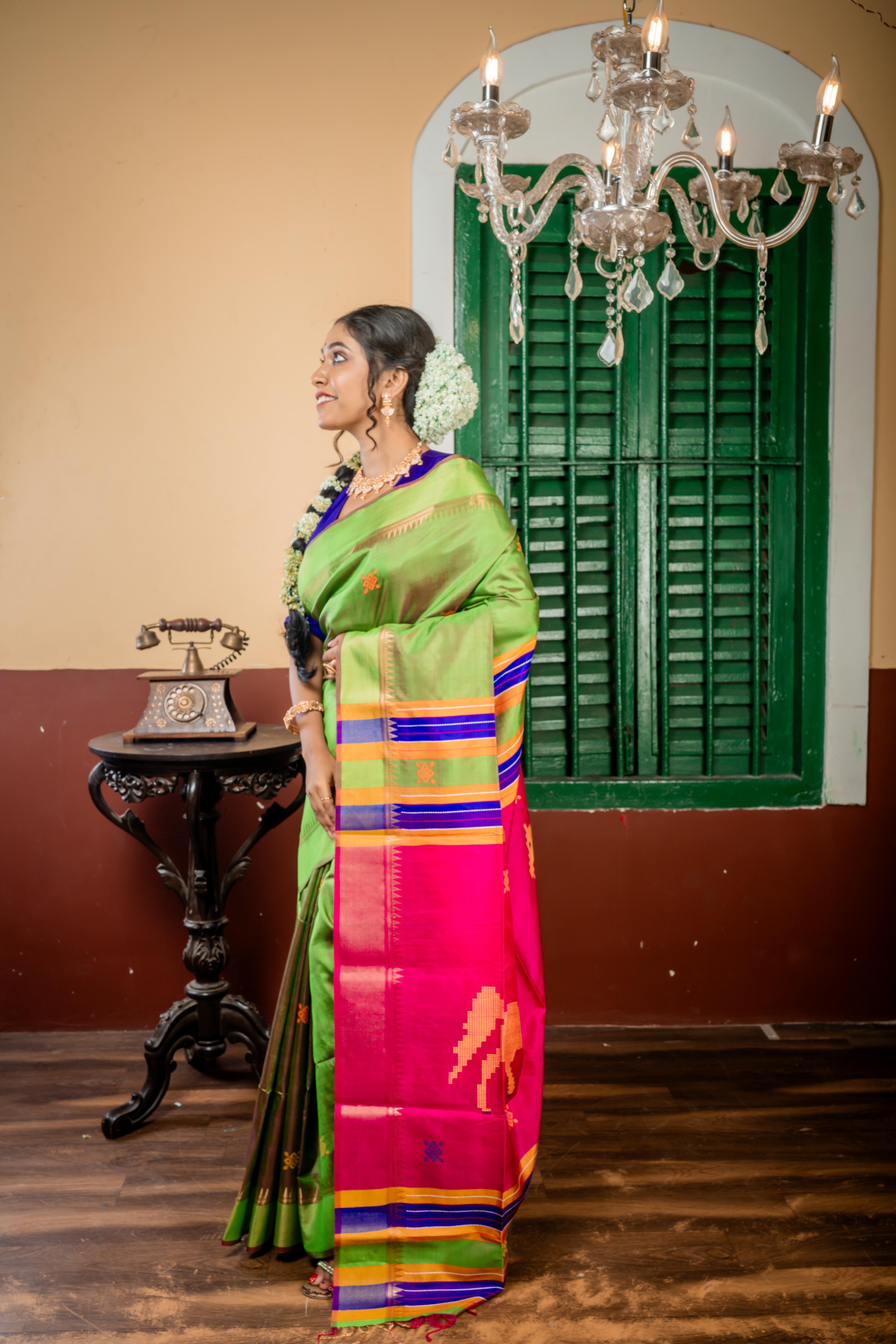 Ashwini || Parrot Green & Magenta dual tone Pure Bishnupuri Katan Handloom 'Kalakshetra' Embroidery Saree with all over Multi-colour Buta and Stripe & 'Horse' motif Pallu