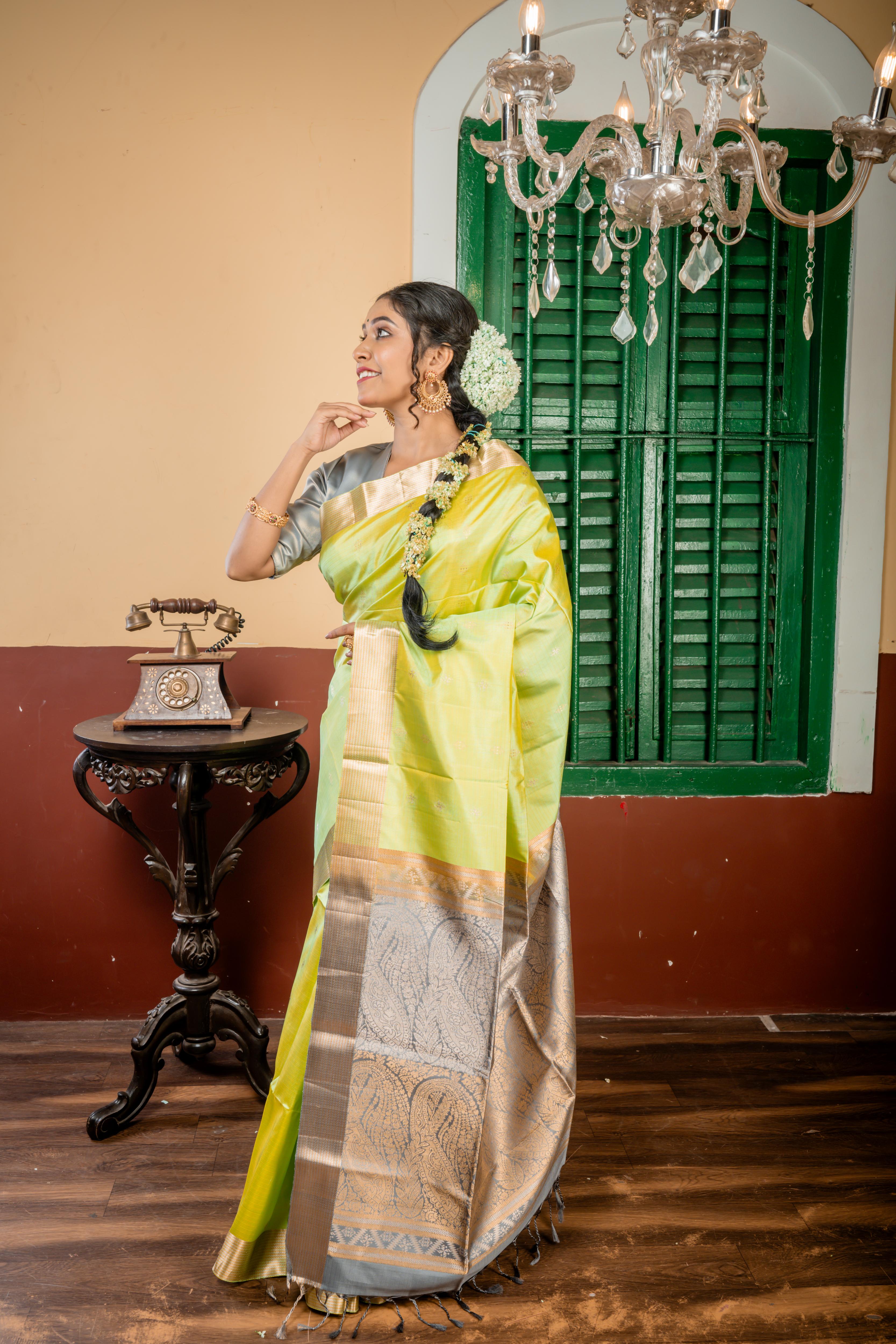 Nayanthara || Mint Green & Olive Yellow Striped Pattu Soft Silk Handloom Saree with all over Matte Gold & Antique Silver Zari Traditional Buta, Smokey Grey & Antique Gold Zari Border and Pallu with Antique Gold & Antique Silver Zari Traditional design