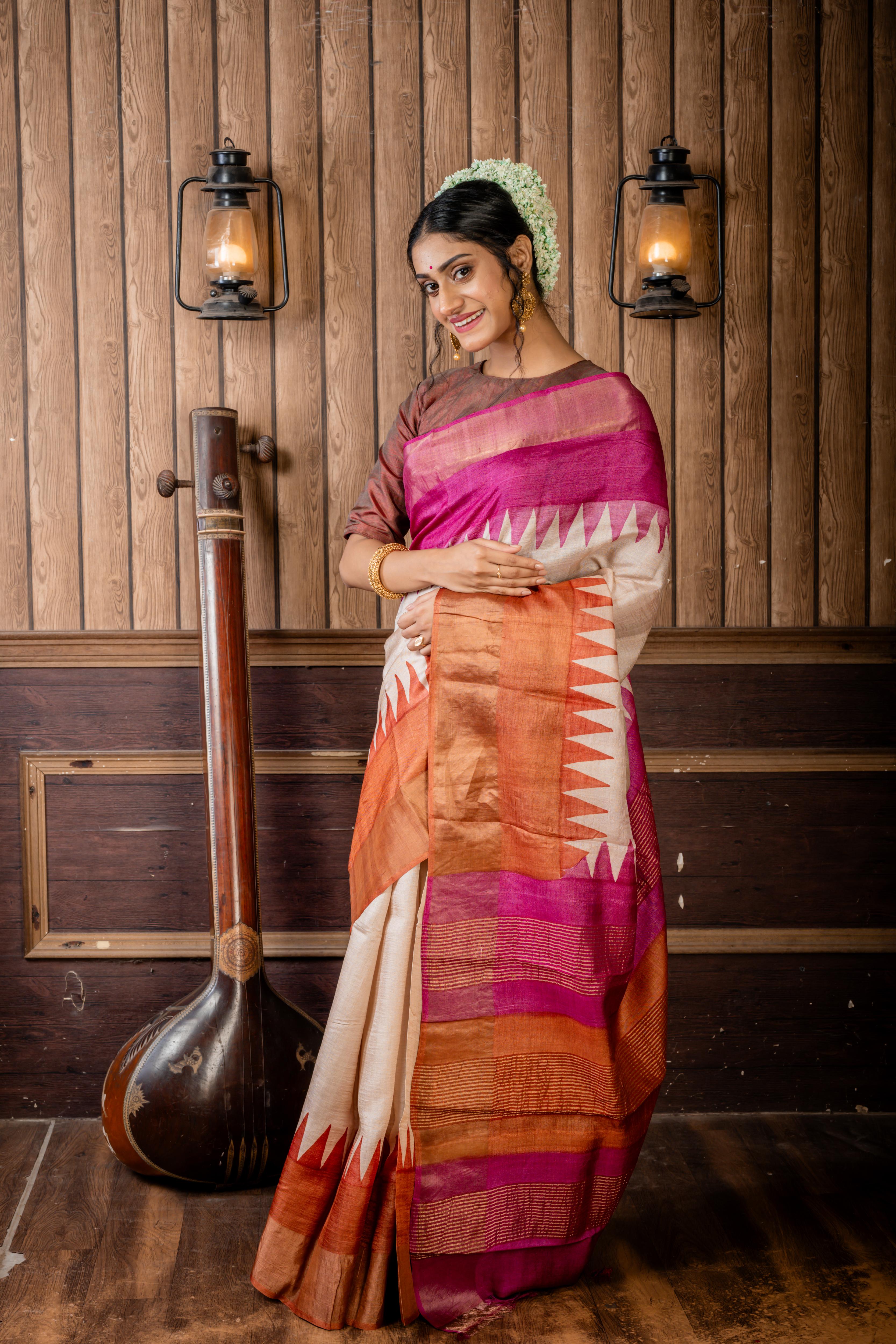 Madhurima || Beige Tussar Saree with Onion Pink & Earthy Brown Temple design Hand Paint 'Ganga-Jamuna' Border and Colour Block & Antique Gold Zari highlights Stripe Pallu