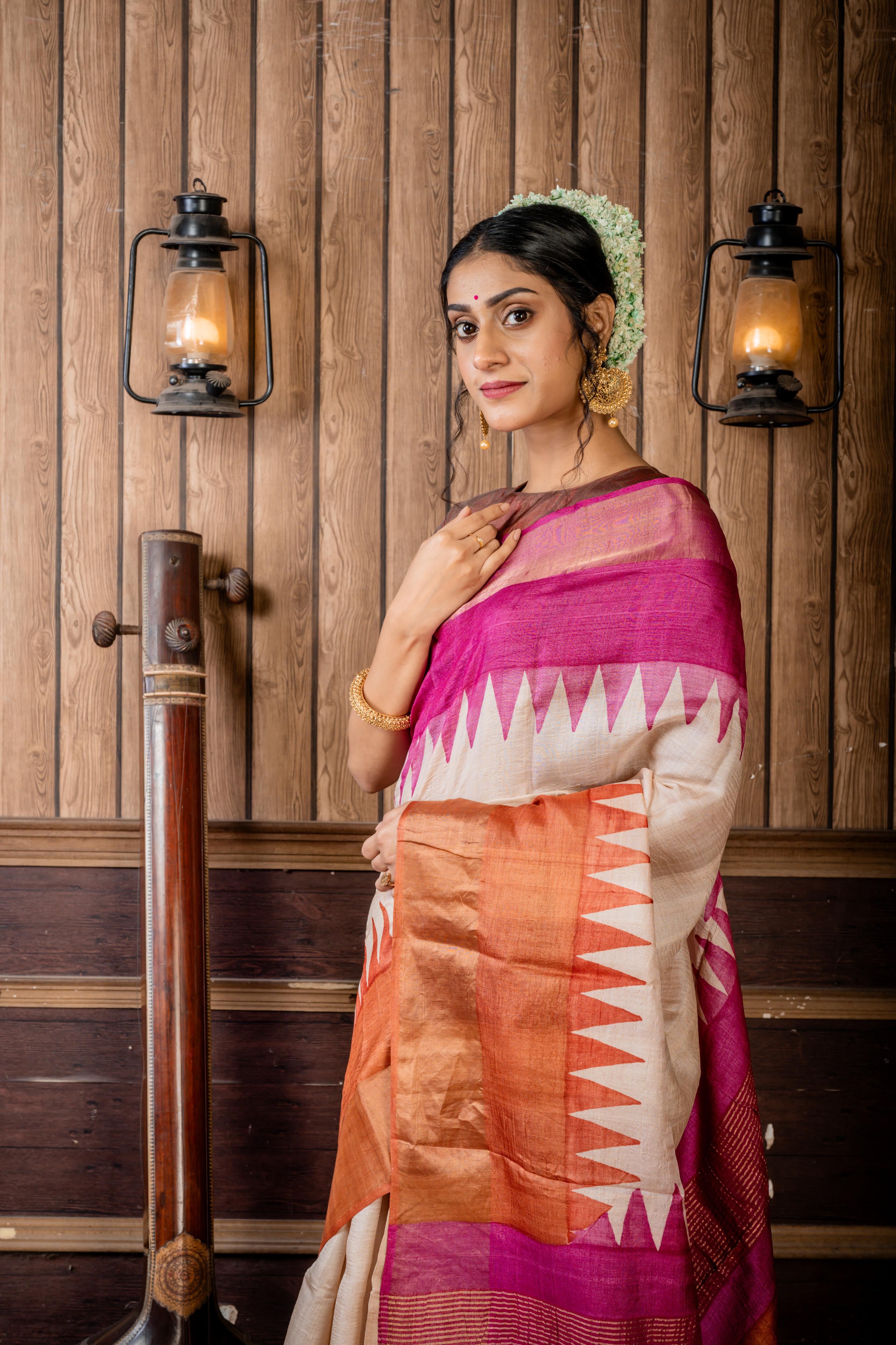 Madhurima || Beige Tussar Saree with Onion Pink & Earthy Brown Temple design Hand Paint 'Ganga-Jamuna' Border and Colour Block & Antique Gold Zari highlights Stripe Pallu