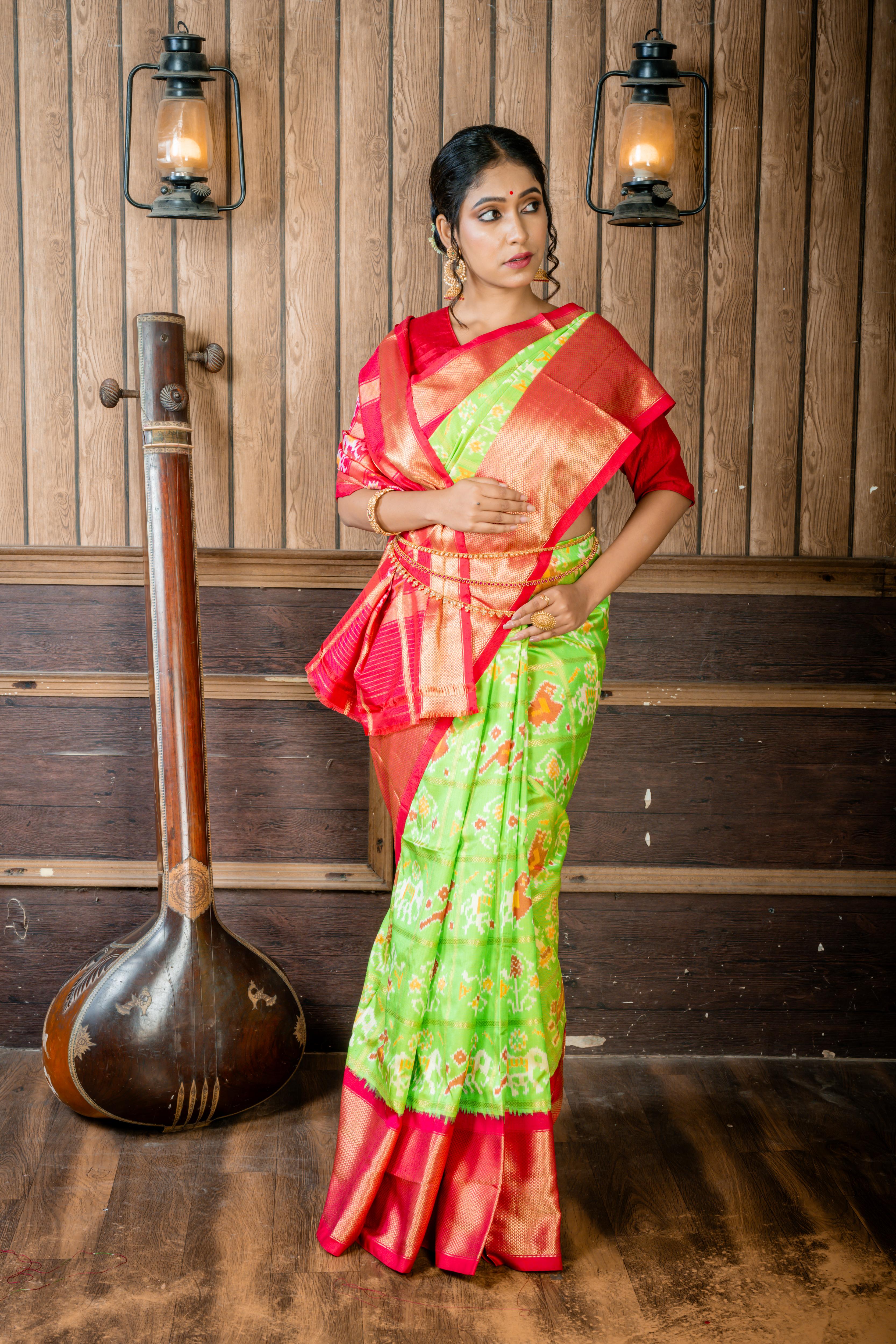 Vasundhara || Parrot Green Pure Silk Pochampally Handloom Saree with all over Multi-colour Ikkat design & Matte Gold Zari Checks,  Beetroot Pink & Antique Gold Zari Traditional design Border & Pallu with Zari Checks highlights