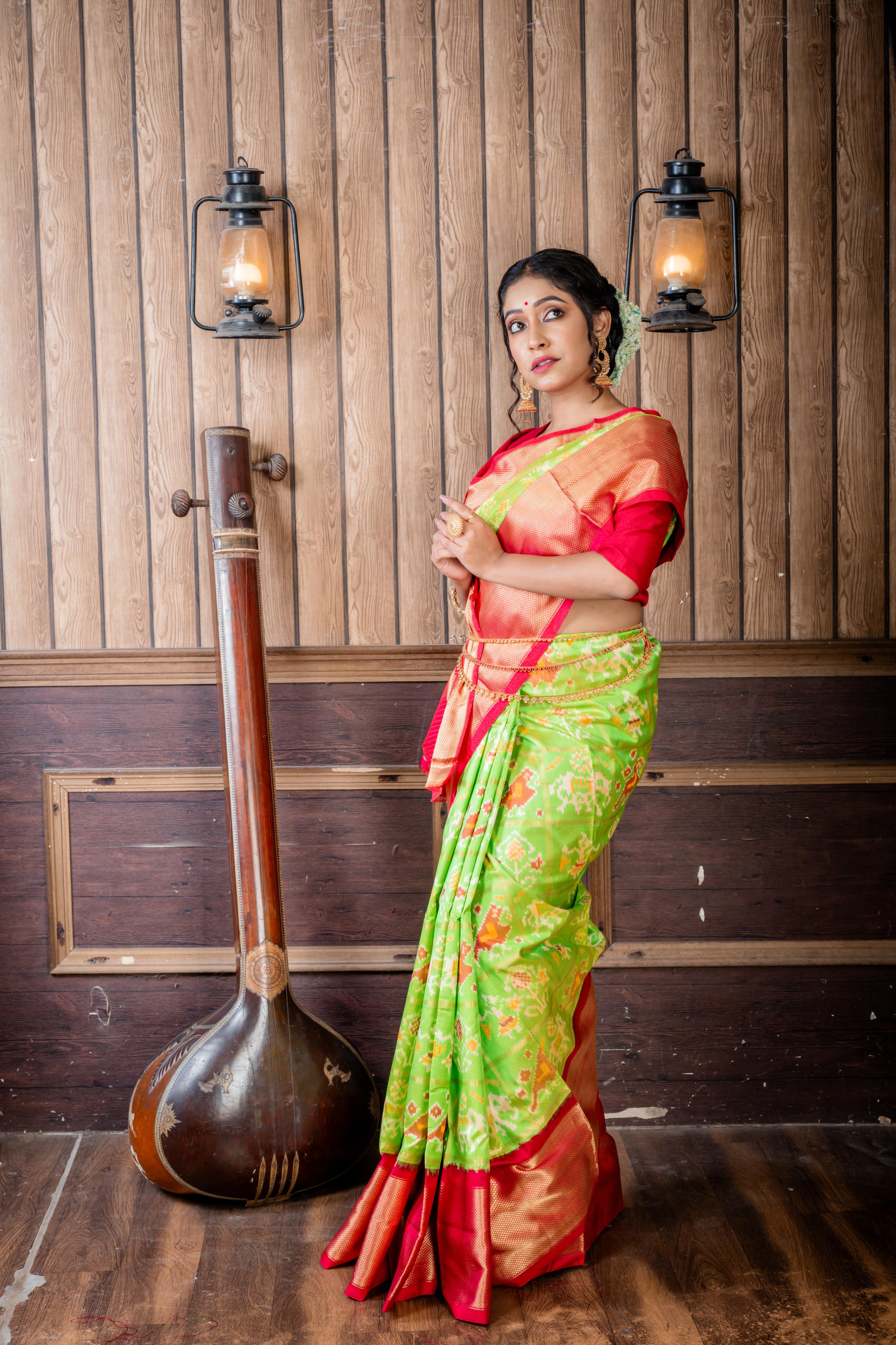 Vasundhara || Parrot Green Pure Silk Pochampally Handloom Saree with all over Multi-colour Ikkat design & Matte Gold Zari Checks,  Beetroot Pink & Antique Gold Zari Traditional design Border & Pallu with Zari Checks highlights