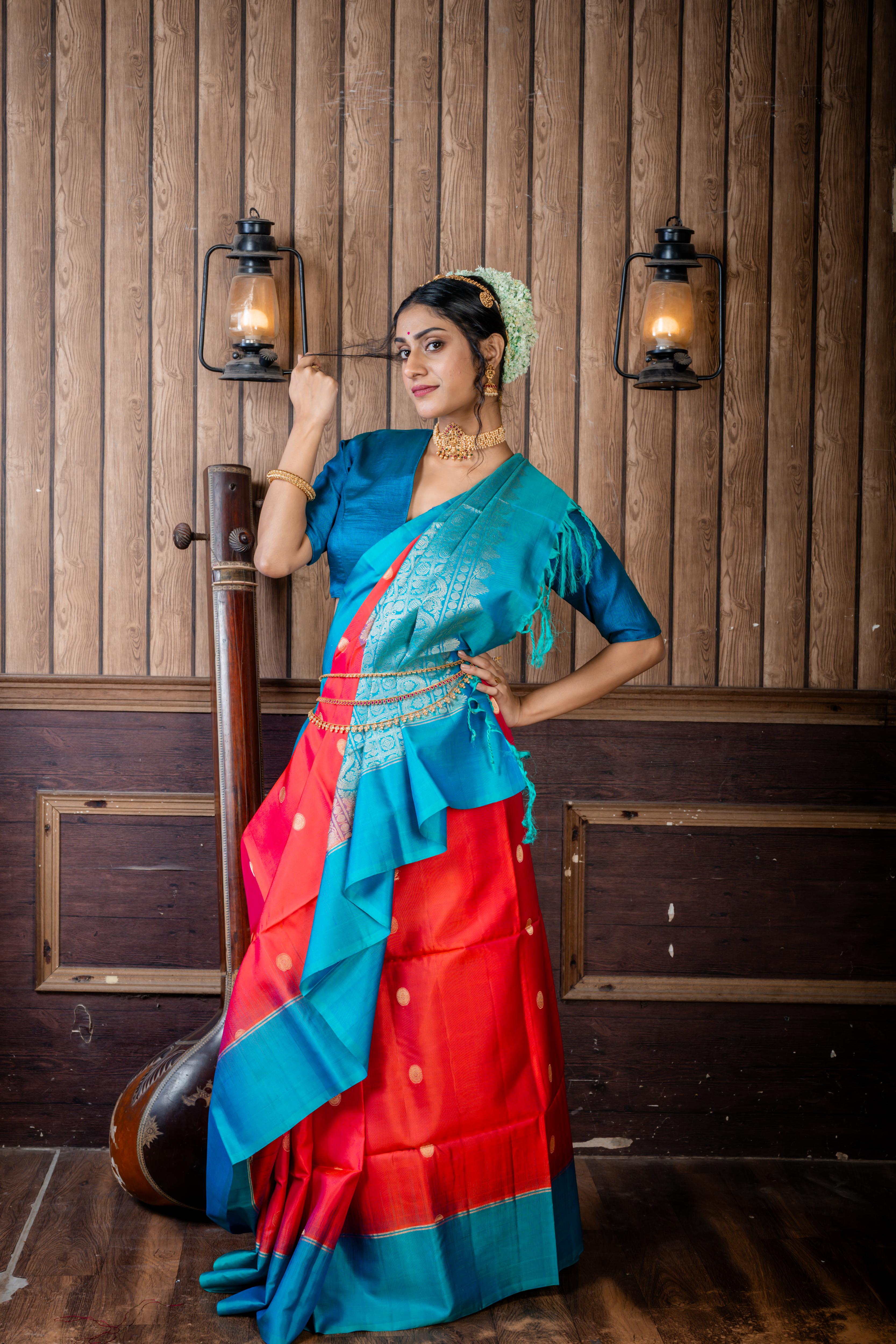 Lalitha || Magenta & Rust Orange dual tone Pattu Soft Silk Handloom Saree with all over Antique Gold Zari Buta and Turquoise Blue & Teal Green dual-tone Plain Border & Pallu with Matte Gold Zari Traditional Checks design