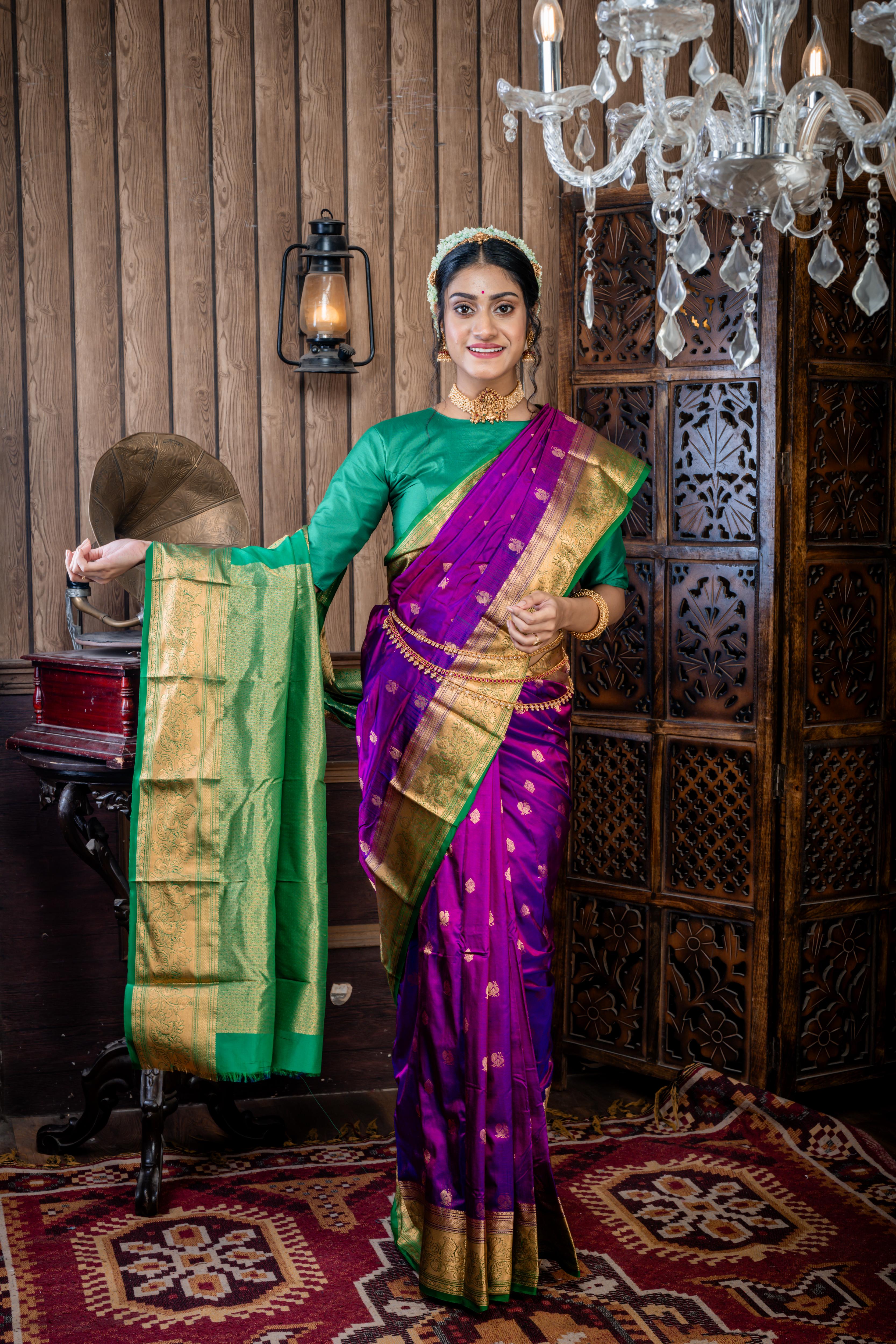 Maitri || Purple & Violet dual tone Pure Kanjivaram Silk Handloom Saree with all over Golden Zari 'Peacock' motif Buta, Dark Green broad & Golden Zari Border and traditional design Pallu