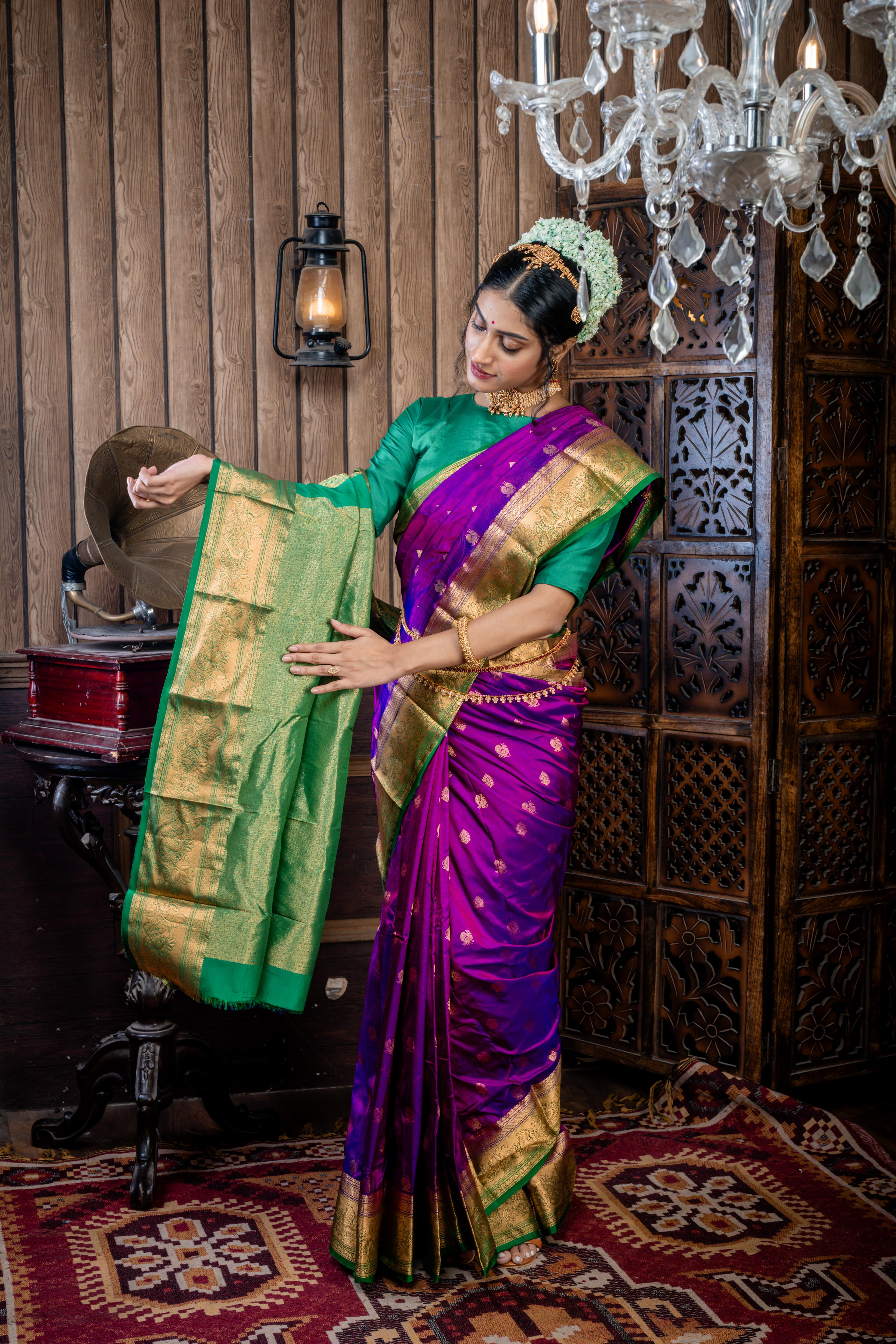 Maitri || Purple & Violet dual tone Pure Kanjivaram Silk Handloom Saree with all over Golden Zari 'Peacock' motif Buta, Dark Green broad & Golden Zari Border and traditional design Pallu