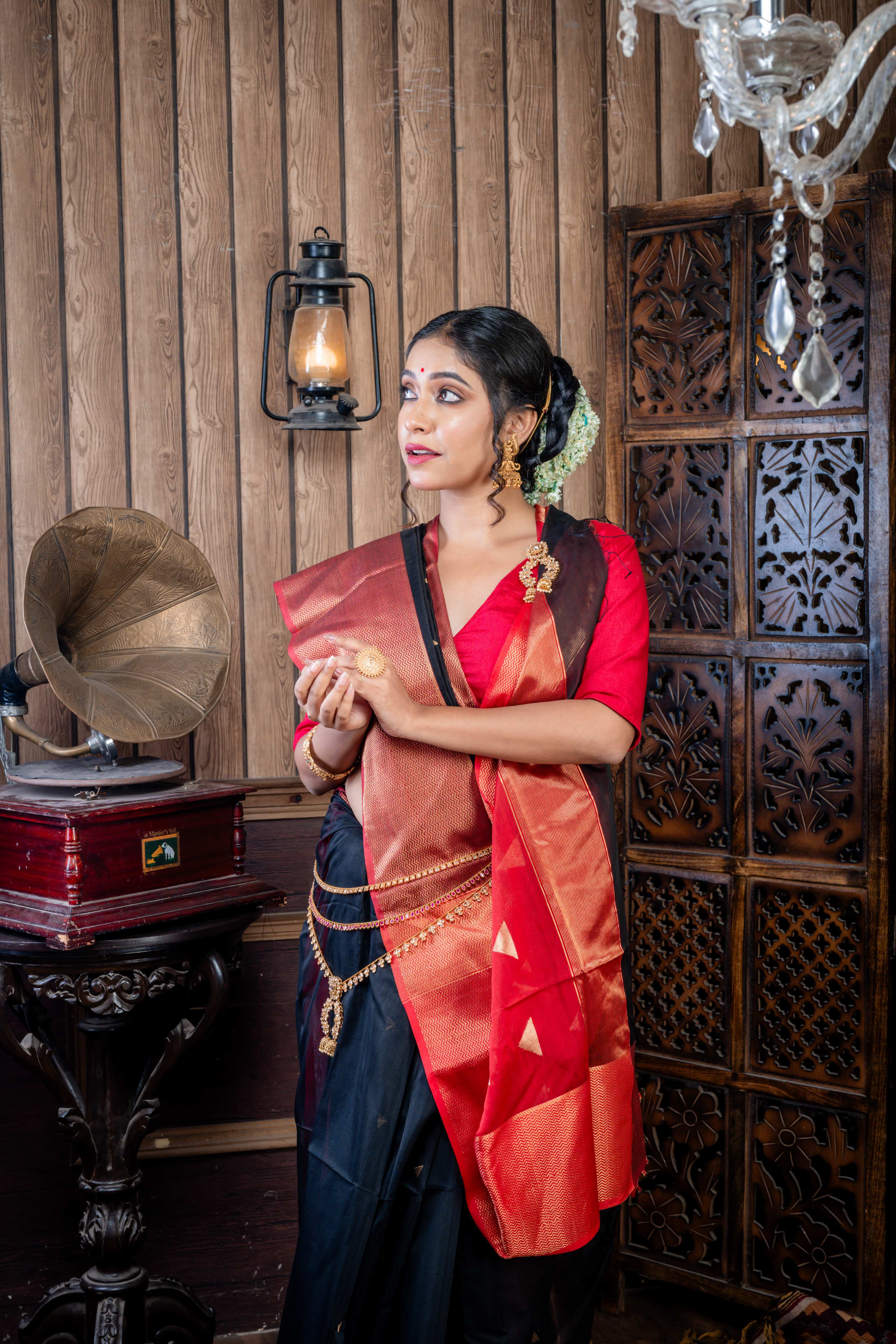 Nishita || Black Cotton Resham Maheshwari Handloom Saree with all over Antique Gold Zari Buta, Dark Garnet Red & Antique Gold Zari Brocade Border and Dark Garnet Red Pallu with Antique Gold Zari Stripe & Copper Buta