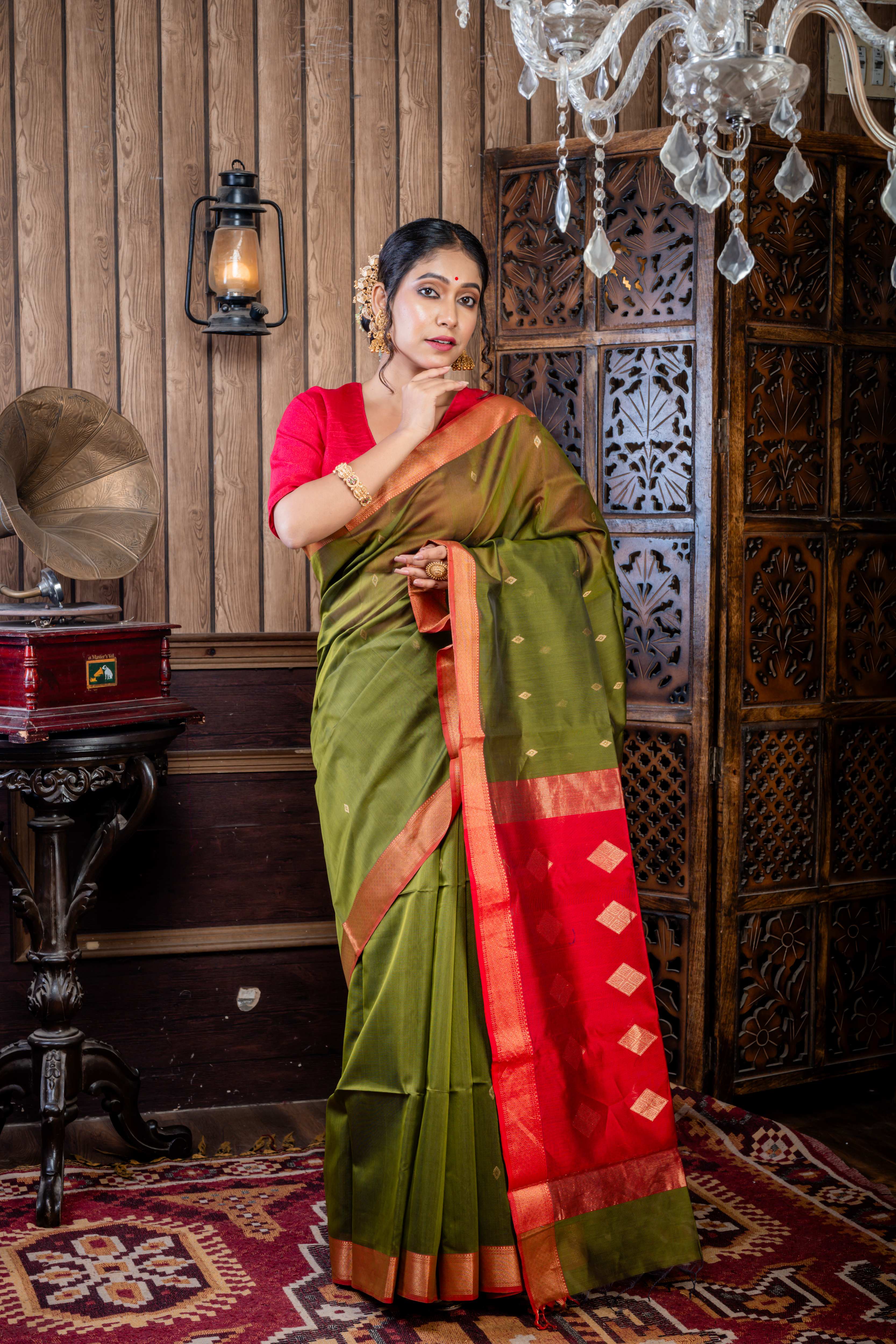 Vidushi || Dark Moss Green Cotton Resham Maheshwari Handloom Saree with all over Matte Gold Zari Buta, Red Clay & Antique Gold Zari Brocade Border and Red & Antique Gold Pallu with Stripe & Traditional Motif