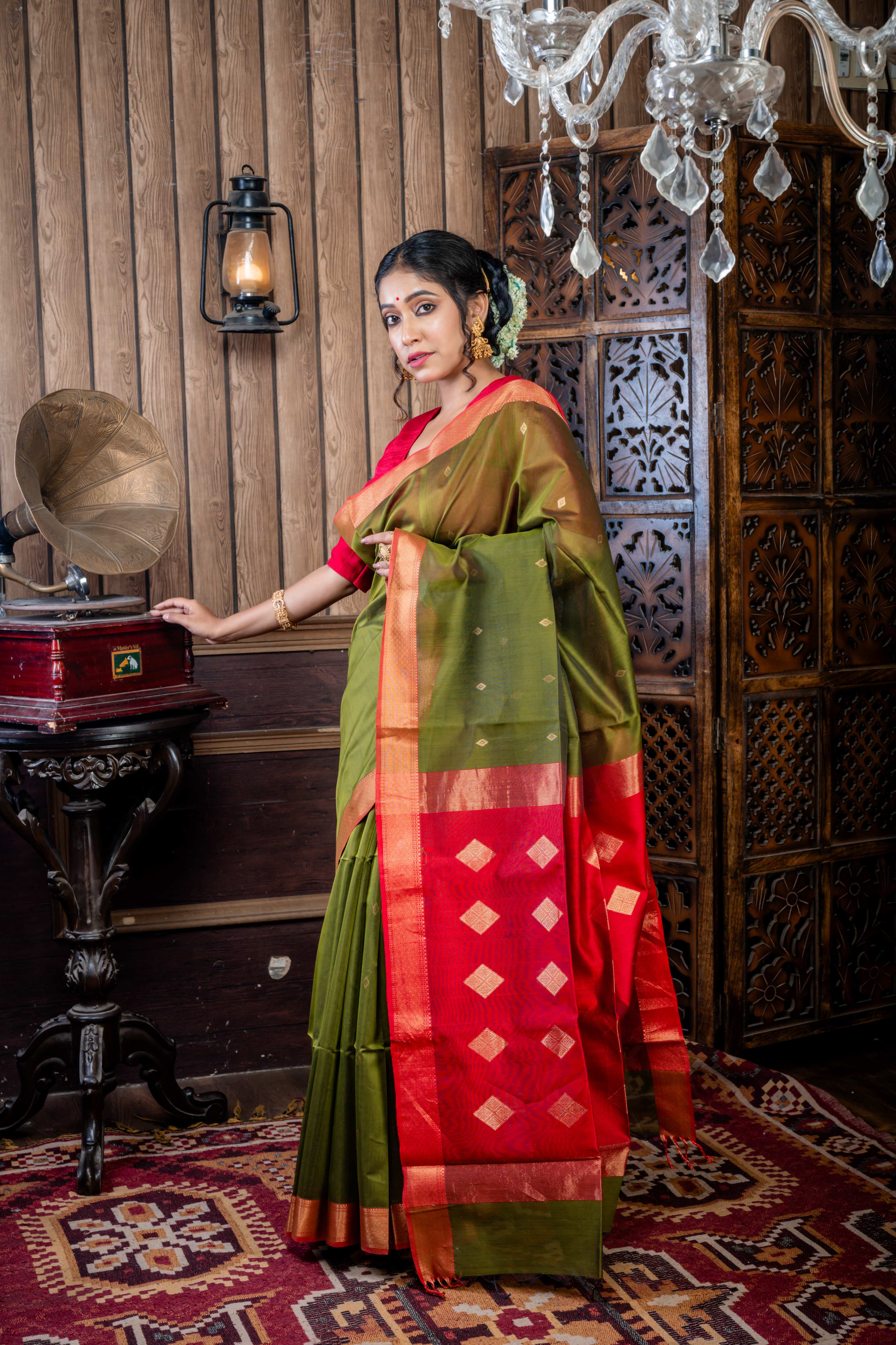 Vidushi || Dark Moss Green Cotton Resham Maheshwari Handloom Saree with all over Matte Gold Zari Buta, Red Clay & Antique Gold Zari Brocade Border and Red & Antique Gold Pallu with Stripe & Traditional Motif