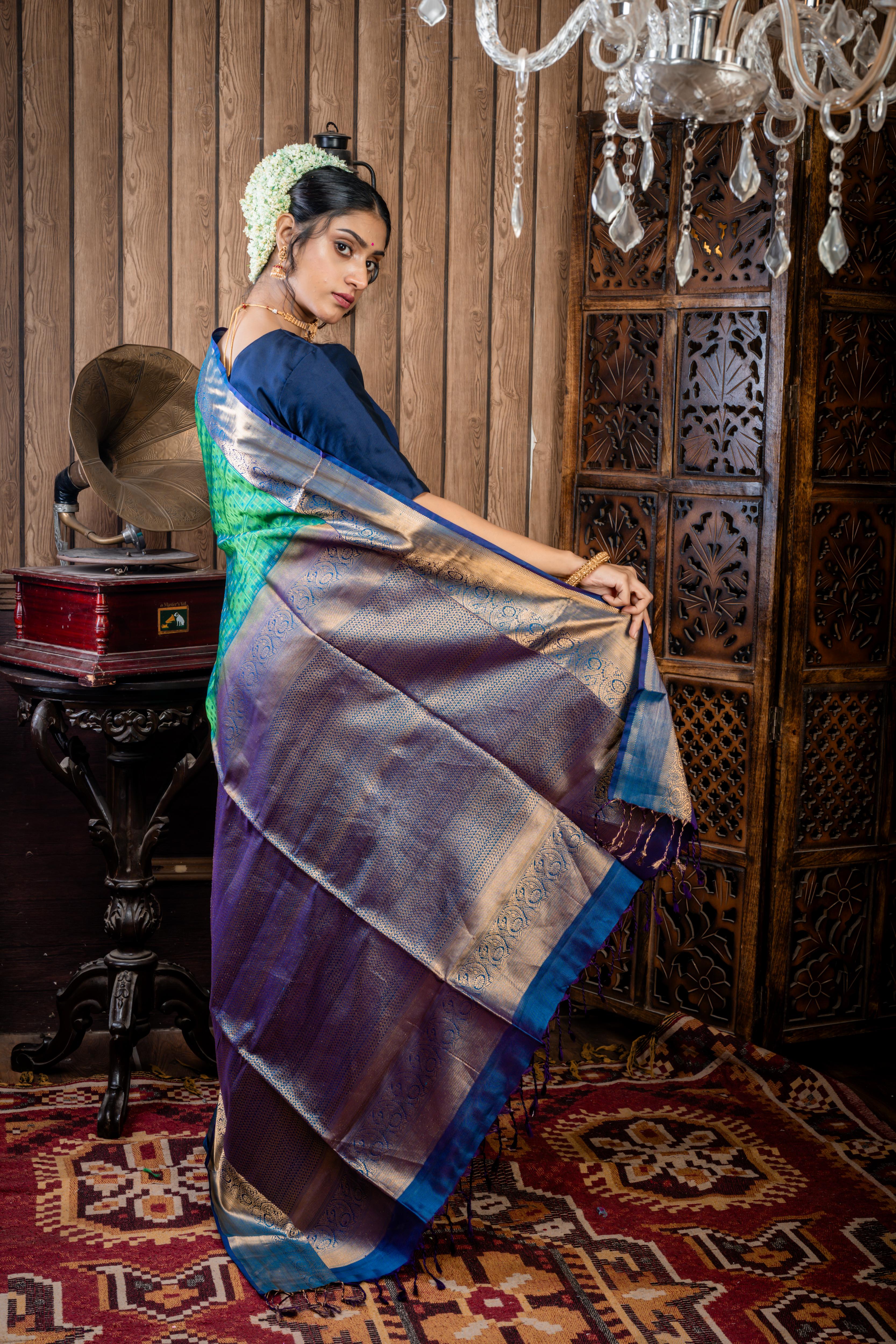 Shruthi || Leaf Green & Peacock Blue dual tone Pattu Soft Silk Handloom Saree with all over Antique Gold Zari, Peacock Blue Resham & Leaf Green Resham Buta & Checks and Violet & Peacock blue dual-tone with Antique Gold Zari Traditional Border & Pallu
